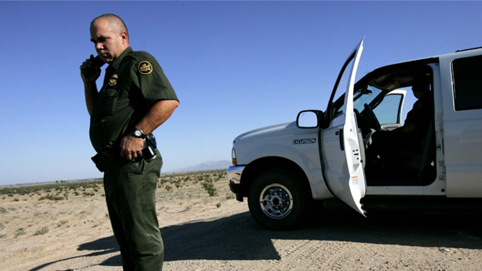 EL CENTRO, CA - AUGUST 29: Border Patrol agent, Scott Plesuk, patrols the border in the desert August 29, 2005 near El Centro, California. The governors of New Mexico and Arizona have declared a state of emergency along the border due to drug trafficking, illegal immigration and threat of terrorists coming through Mexico. (Photo by Sandy Huffaker/Getty Images)