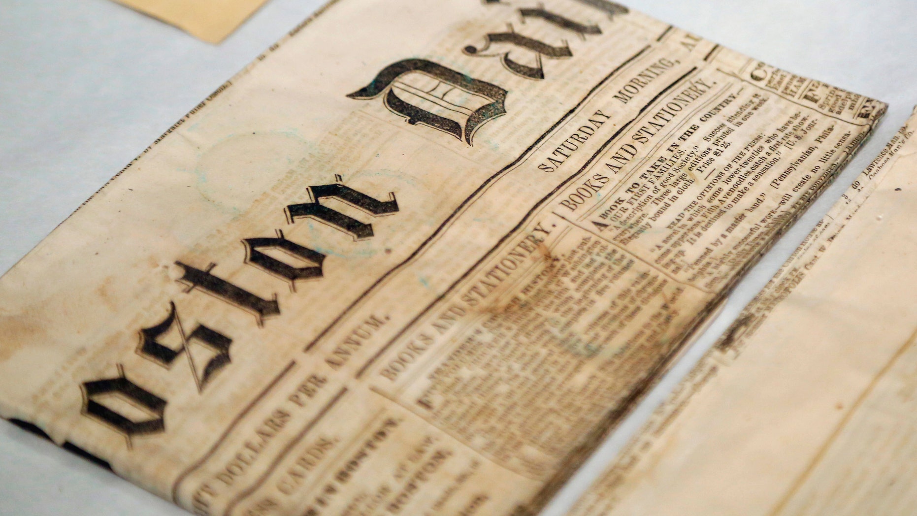 Newspapers removed from a time capsule, which was placed under a cornerstone of the State House in 1795, sit in archival boxes at the Museum of Fine Arts, Boston, Massachusetts, January 6, 2015.