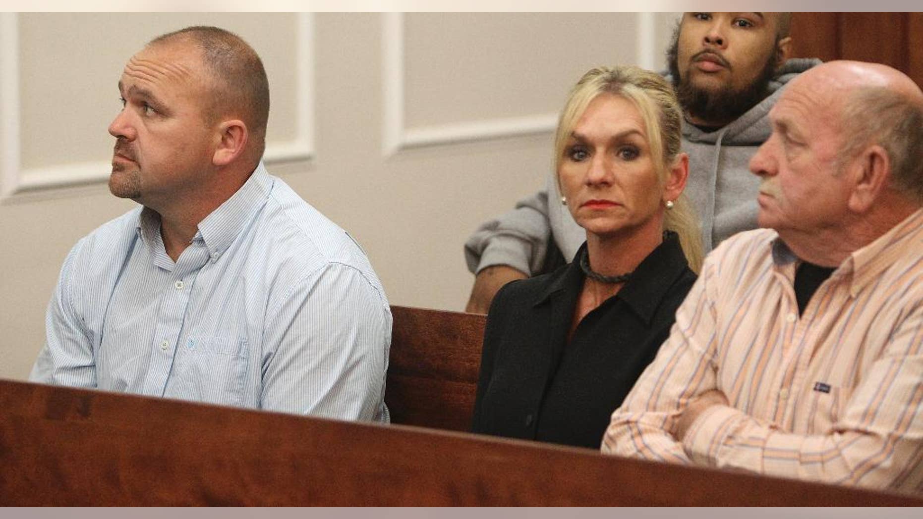 From left, Gilbert "Toby" Curtsinger, his wife, Julie Curtsinger, and her father Robert McKinney sit together in Franklin County Circuit Court in Frankfort, Ky on Friday, May 22, 2015. The Curtsingers pleaded not guilty to multiple charges Friday. Both are charged with engaging in organized crime. McKinney, also facing charges, pleaded not guilty (Michael Clevenger/The Courier-Journal via AP) NO SALES; MAGS OUT; NO ARCHIVE; MANDATORY CREDIT