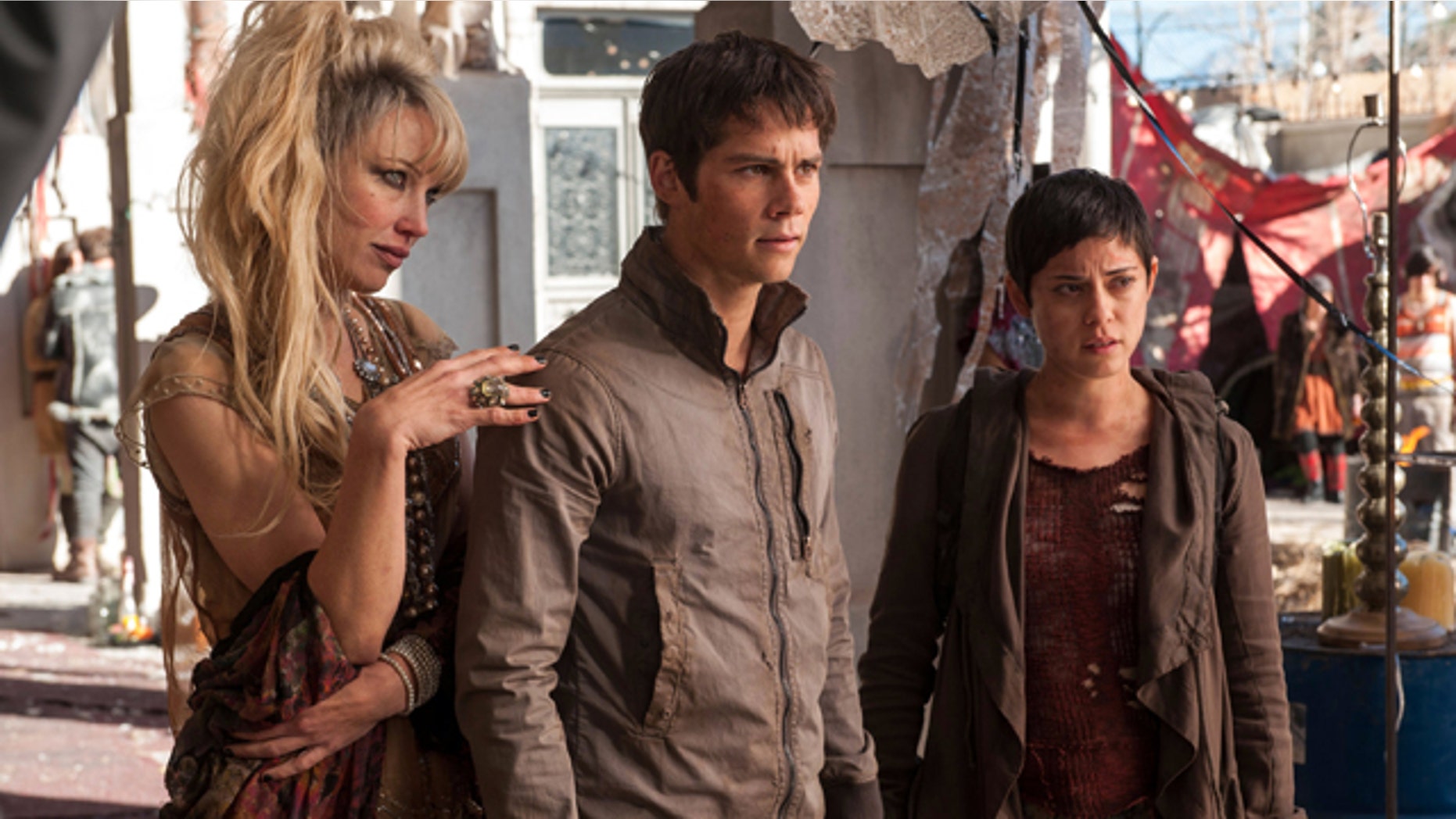 In this image released by 20th Century Fox, Jenny Gabrielle, from left, Dylan OBrien and Rosa Salazar appear in a scene from the film, 'Maze Runner: The Scorch Trials.' (Richard Foreman, Jr./20th Century Fox via AP)