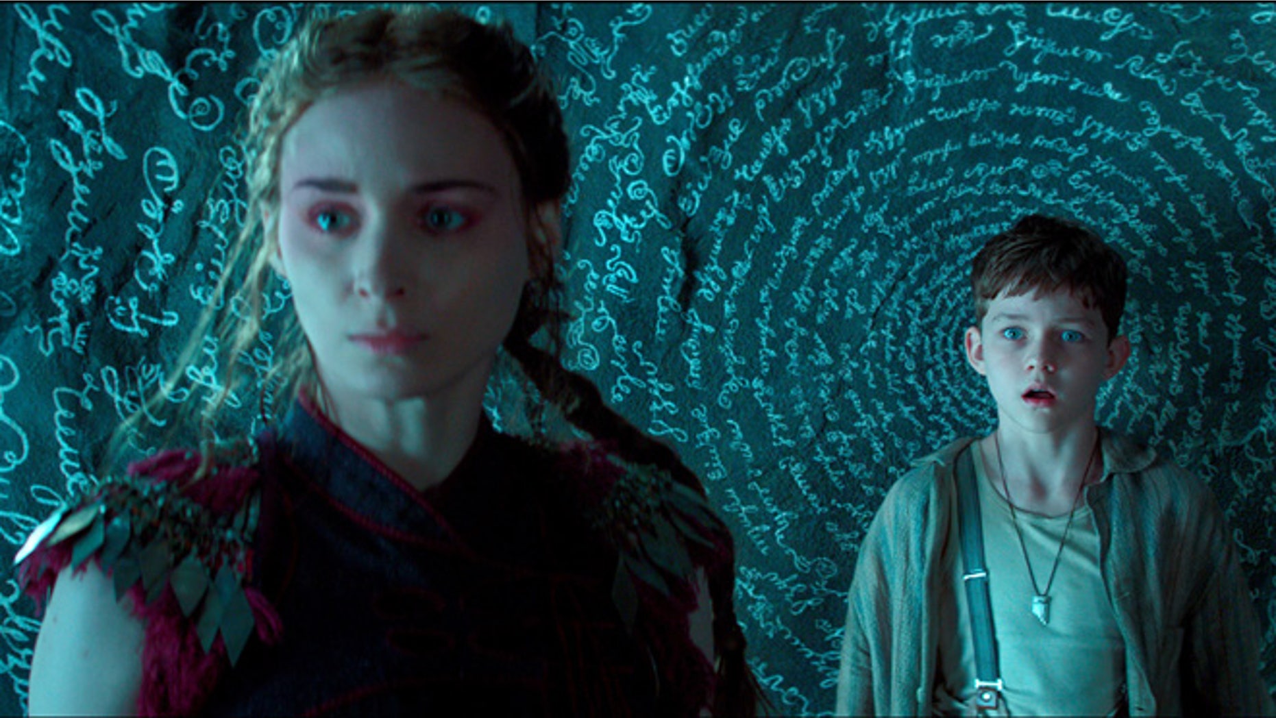 This photo provided by courtesy of Warner Bros. Pictures shows, Rooney Mara, left, as Tiger Lily, and Levi Miller as Peter, in a scene from the film, "Pan."
