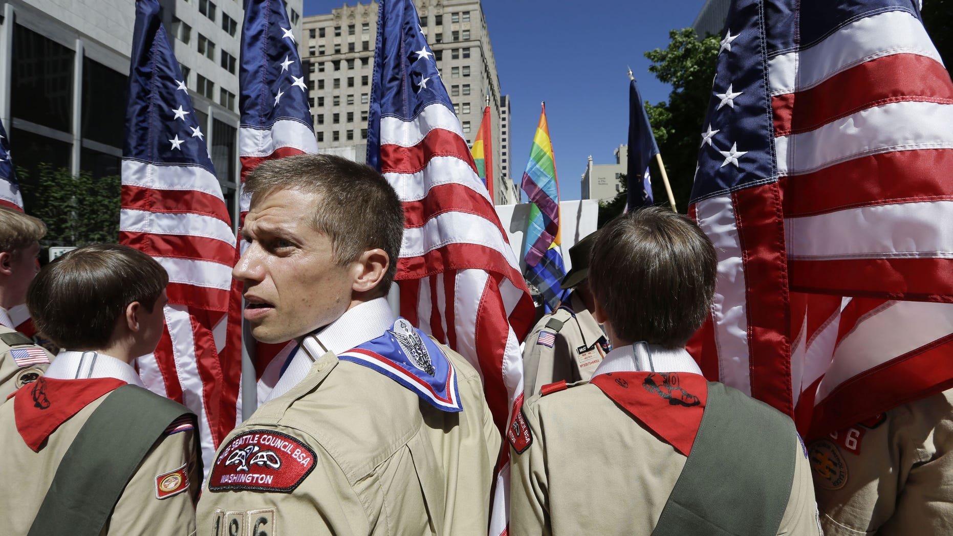 June 30, 2013: In this file photo, Boy Scouts from the Chief Seattle Council carry U.S. flags as they prepare to march in the Gay Pride Parade in downtown Seattle.