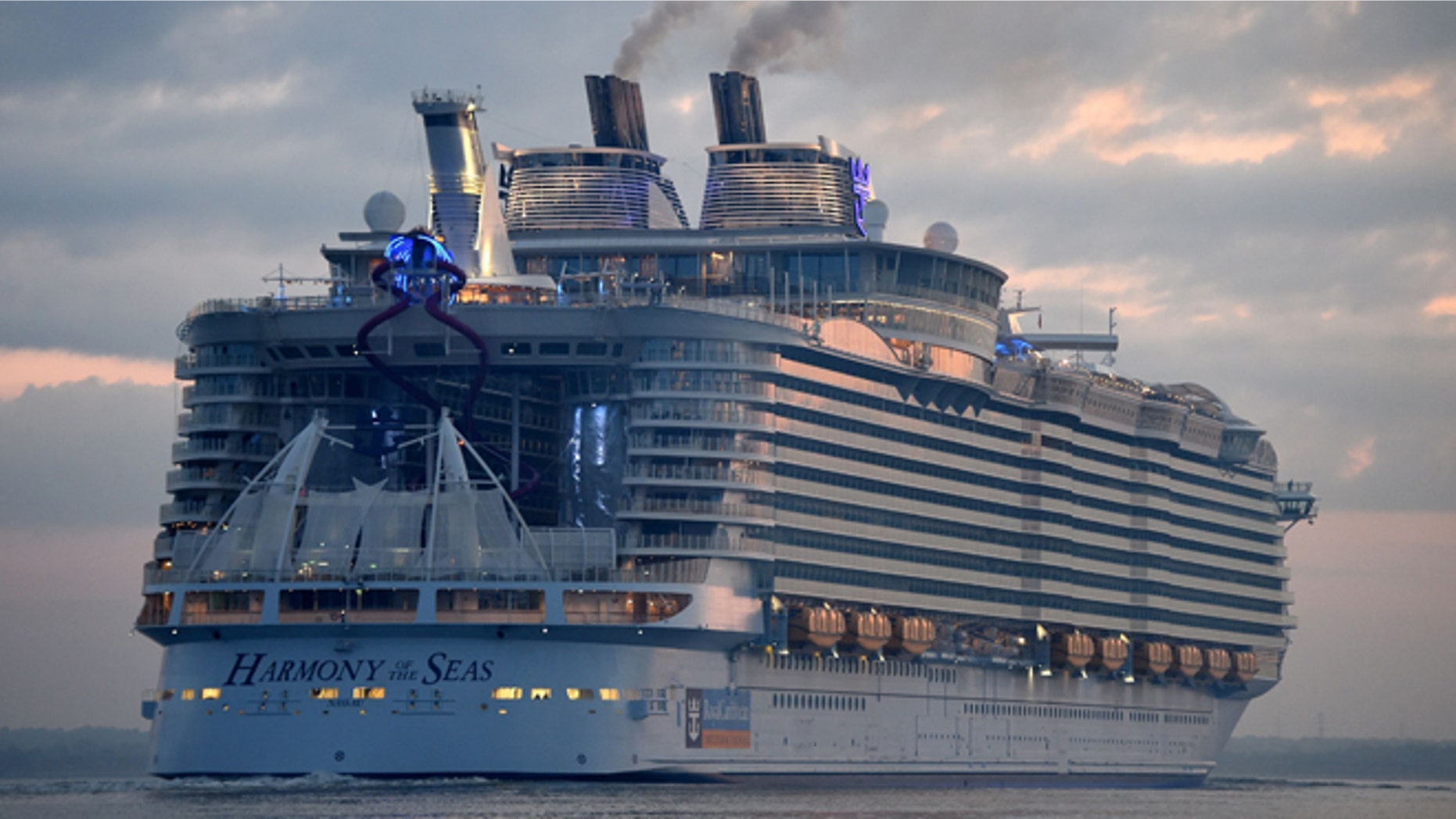 The world's largest passenger ship, Harmony of the Seas, owned by Royal Caribbean, docks on arrival in Southampton, England, Tuesday May 17, 2016, ahead of her maiden cruise. After 32-months being fitted out in a French shipyard the 16-deck Harmony of the Seas will set out on its inaugural voyage on May 22 bound for Barcelona, Spain. (Andrew Matthews/PA via AP) UNITED KINGDOM OUT - NO SALES - NO ARCHIVES