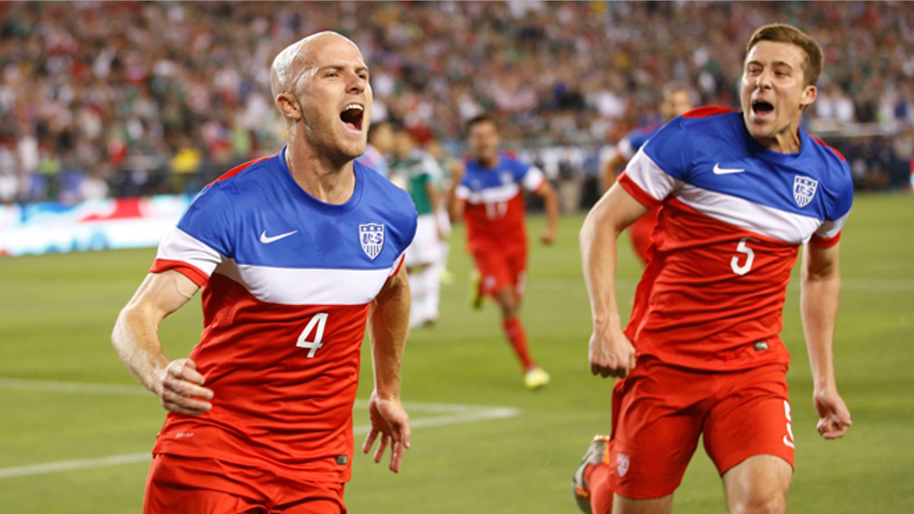 U.S. midfielder Michael Bradley, left, celebrates with defender Matt Besler (5) after scoring a goal against Mexico during the first half of an international friendly soccer match, Wednesday, April 2, 2014, in Glendale, Ariz. (AP Photo/The Arizona Republic, Michael Chow) MESA OUT MARICOPA COUNTY OUT MAGS OUT NO SALES