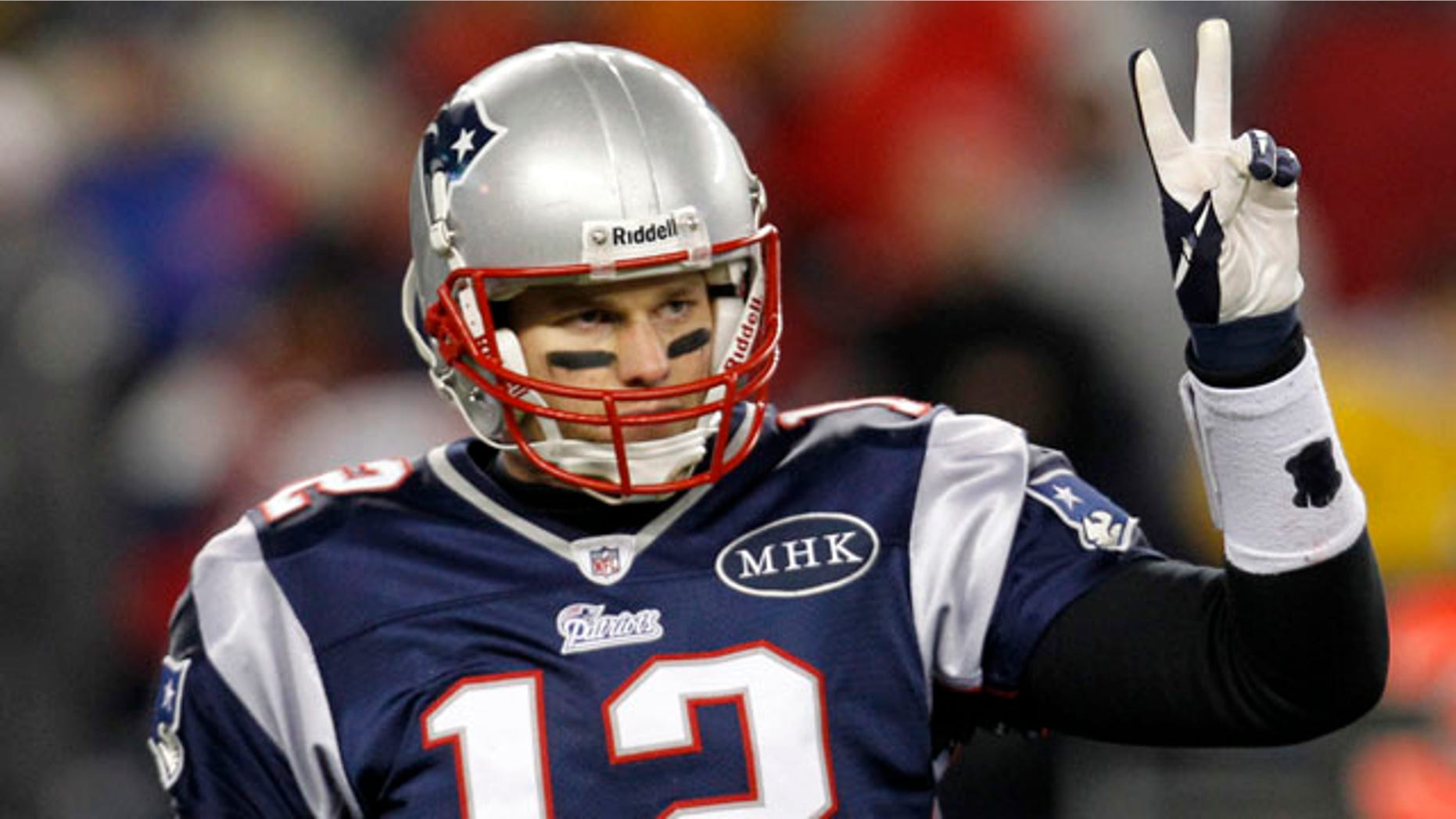 New England Patriots quarterback Tom Brady signals to his bench during the second half of an NFL divisional playoff football game against the Denver Broncos Saturday, Jan. 14, 2012, in Foxborough, Mass. (AP Photo/Elise Amendola)