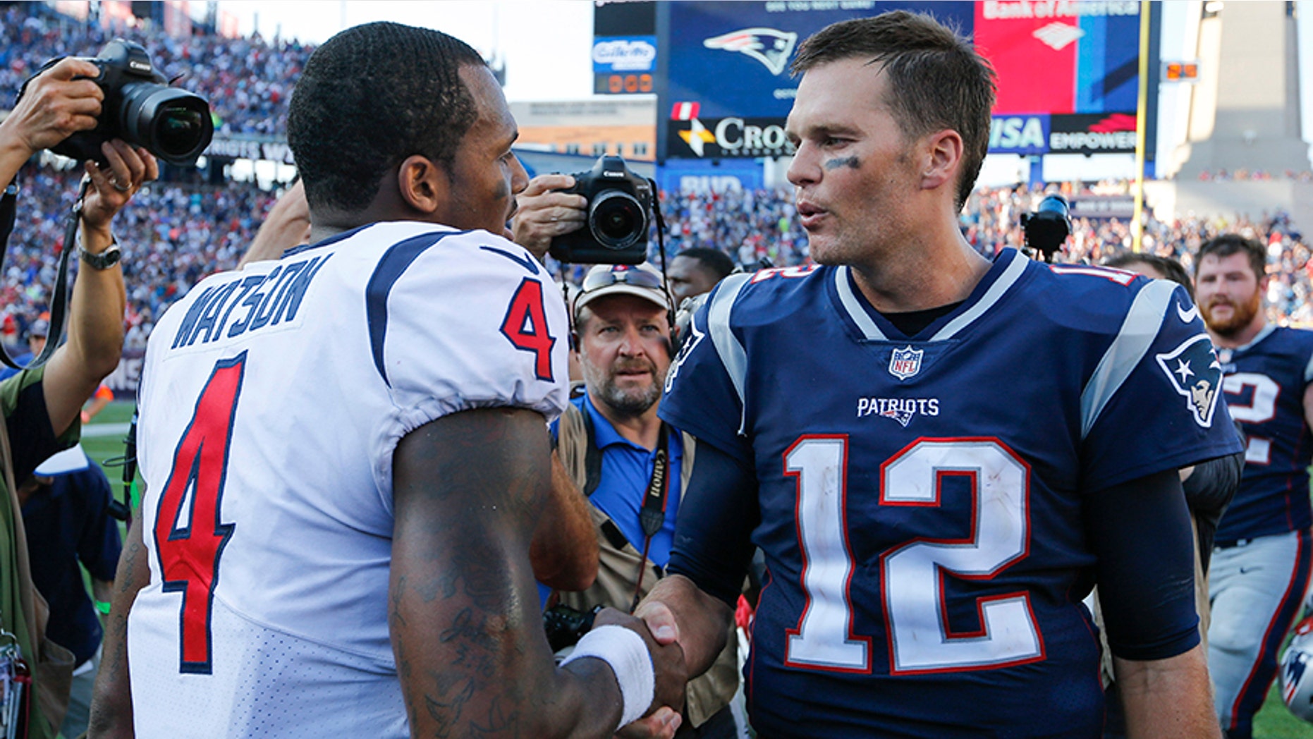 New England Patriots quarterback Tom Brady greets Houston Texans quarterback Deshaun Watson after their game in Foxborough, September 24, 2017.