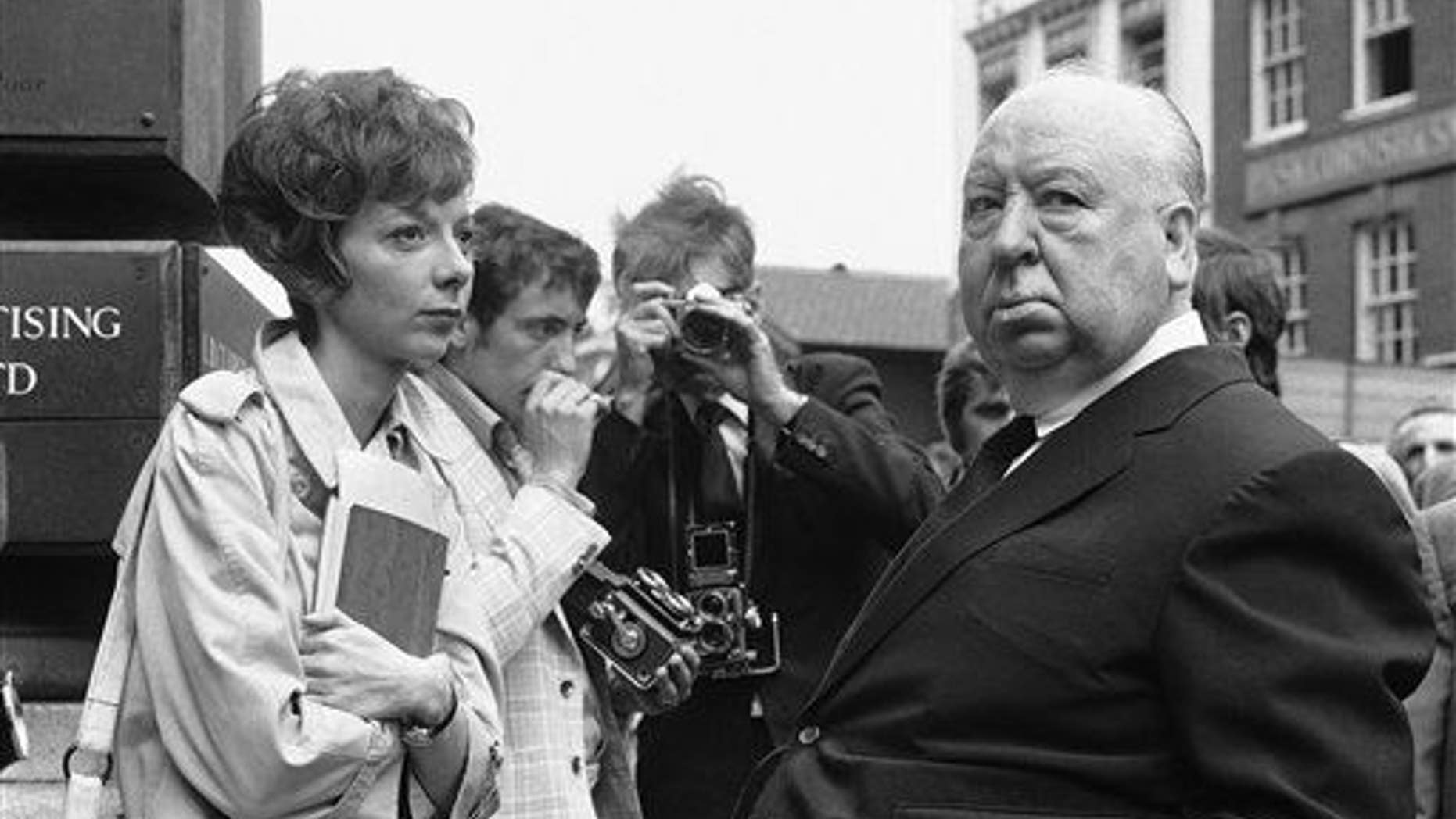 In this July 26, 1971 file photo, British film producer and director Alfred Hitchcock, right, discusses filming with actress Anna Massey, one of the stars of "Frenzy", in Covent Garden Market, London.