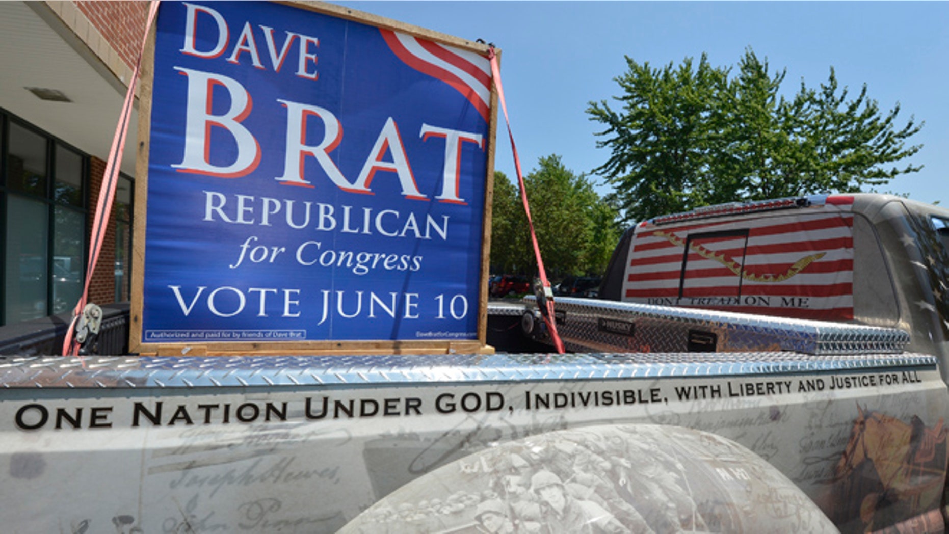 FILE: June 11, 2014: A truck driven by a supporter for Tea Party candidate Dave Brat's campaign in front of his headquarters in Glen Allen, Va.