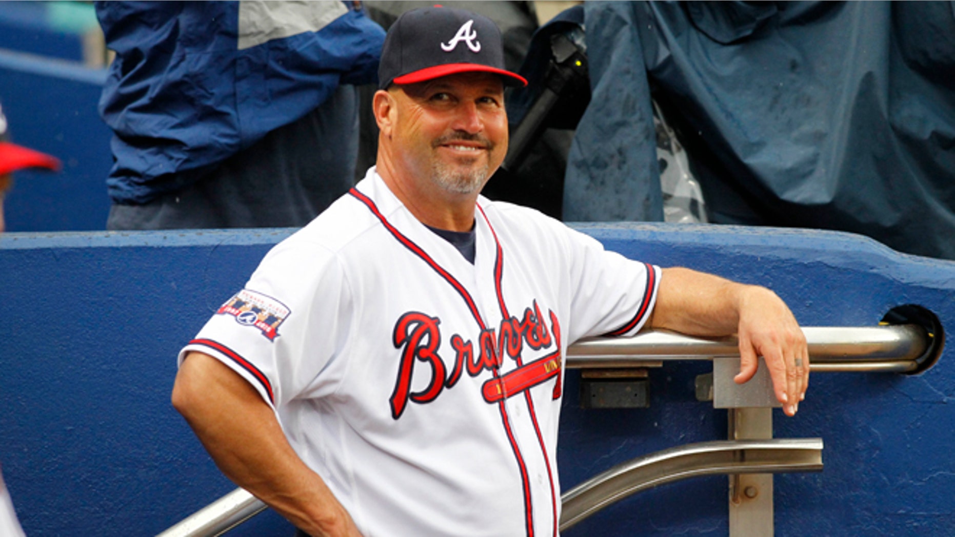 Atlanta Braves manager Fredi Gonzalez (33) smiles in the dugout prior to a baseball game against the Philadelphia Phillies, Thursday, May 12, 2016, in Atlanta. (AP Photo/Brett Davis)