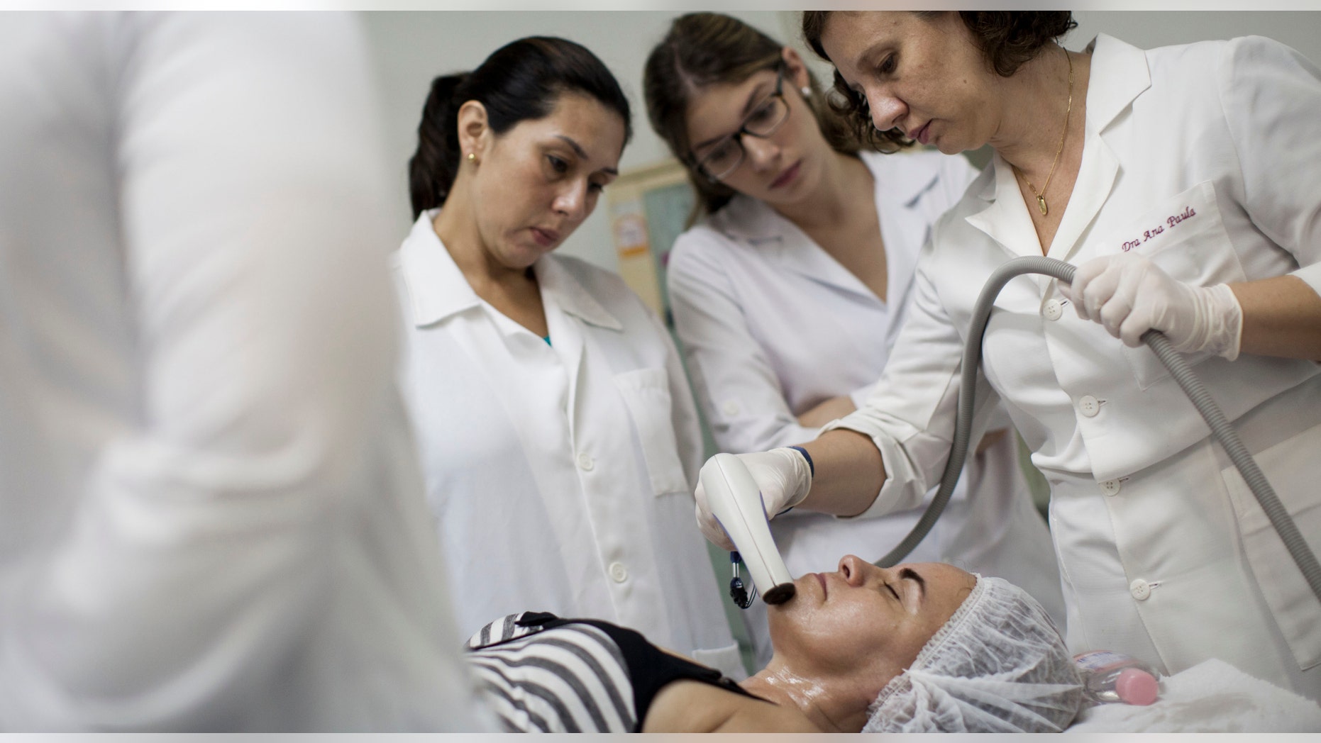 March 14: Nilcea Furtado receives a free of charge radio-frequency treatment by Dr. Ana Paula, right, at the Brazilian Society of Aesthetic Medicine clinic in Rio de Janeiro, Brazil. (AP Photo/Felipe Dana)