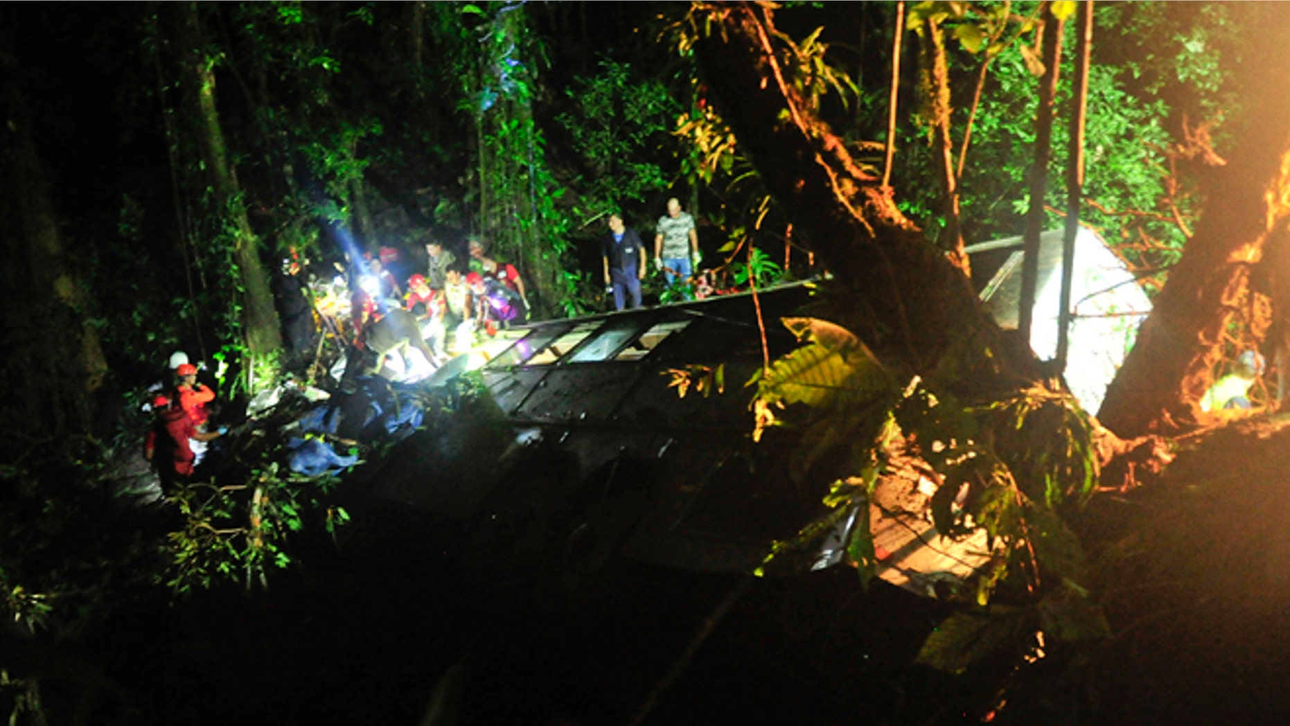 Rescue personnel work at the site where a tourist bus crashed killing at least 49 people, according to the the Santa Catarina State security secretary, near the city of Joinville, southern state of Santa Catarina, Brazil, Saturday, March 14, 2015. (AP Photo/Salmo Duarte, Agence RBS)