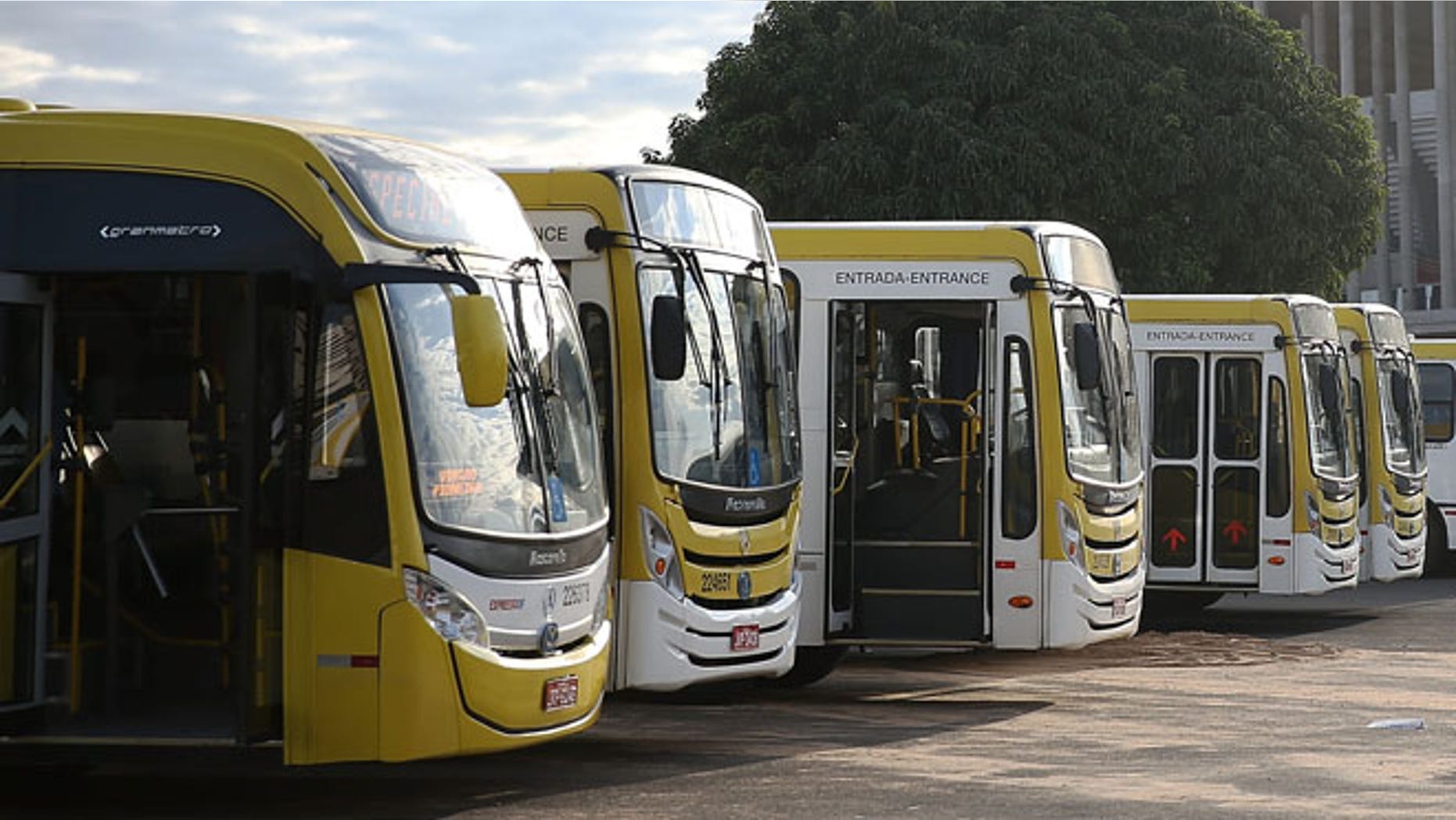BRASILIA, BRAZIL - JUNE 03: Buses are parked in front of the 72,000-seat Mane Garrincha Stadium, which is now used primarily as a municipal bus parking lot, on June 3, 2015 in Brasilia, Brazil. Brazil constructed a number of expensive stadiums for the 2014 FIFA World Cup which now sit mostly empty in part because there is no popular local team to draw attendance. (Photo by Mario Tama/Getty Images)