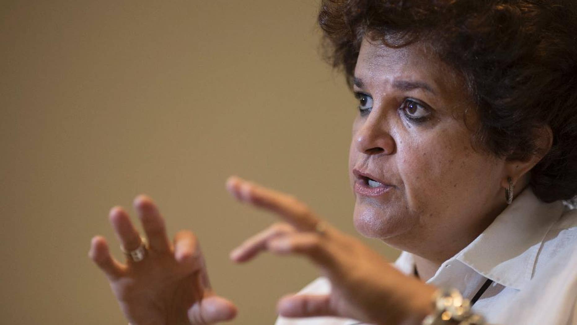 Brazil's Environment Minister Izabella Teixeira speaks during an interview in Rio de Janeiro, Brazil, Wednesday, Nov. 5, 2014. Teixeira says her nation will assume a protagonist role at a climate change conference in Peru, and will hold developed nations accountable for commitments to reduce carbon emissions. (AP Photo/Felipe Dana)