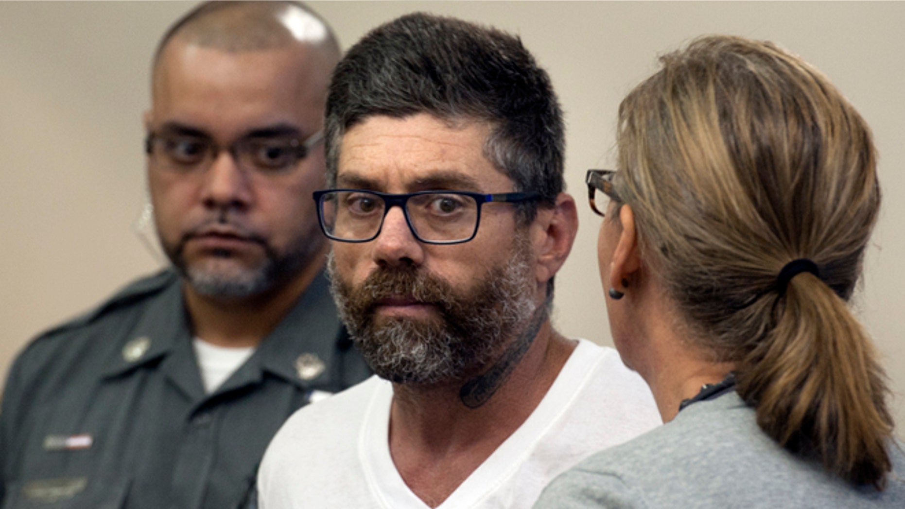 Walter DaSilva, center, of Danbury, Conn., appears in Superior Court for an extradition hearing in Bridgeport, Conn., on Monday, Aug. 8, 2016. DaSilva was arrested in Bridgeport on Friday, and is wanted as a suspect in the July 3 fatal shooting of his 19-year old daughter, Sabrina DaSilva, in New Bedford, Mass. (Ned Gerard/Hearst Connecticut Media via AP, Pool)