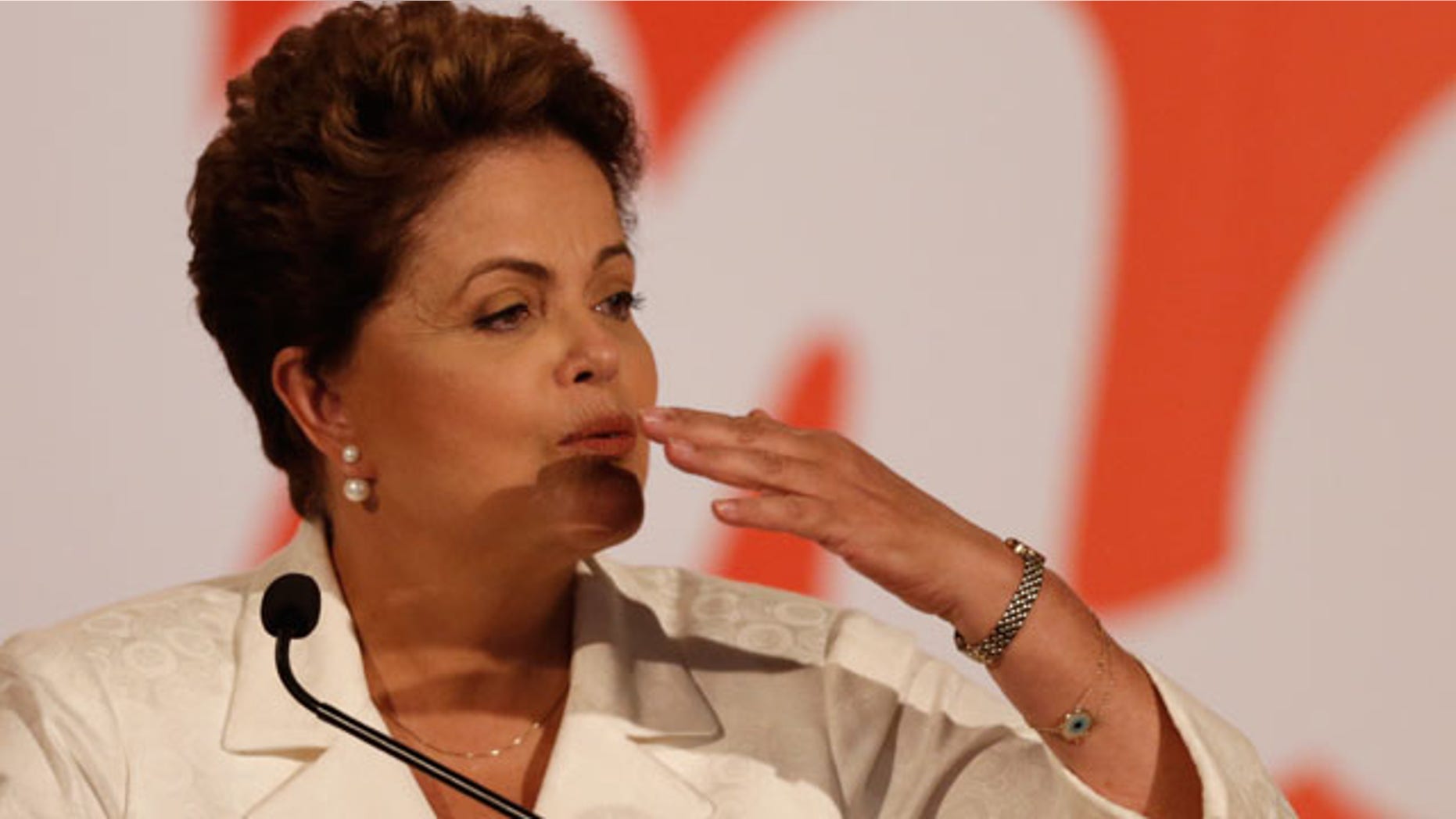 October 5, 2014: Brazil's President Dilma Rousseff blows a kiss during a press conference in Brasilia. Official results showed Sunday that President Dilma Rousseff will face challenger Aecio Neves in a second-round vote in Brazil's most unpredictable presidential election since the nation's return to democracy nearly three decades ago. (AP Photo/Eraldo Peres)