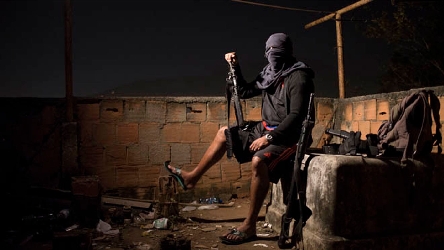 A drug gang leader poses for a photo in a slum in Rio de Janeiro, Brazil.