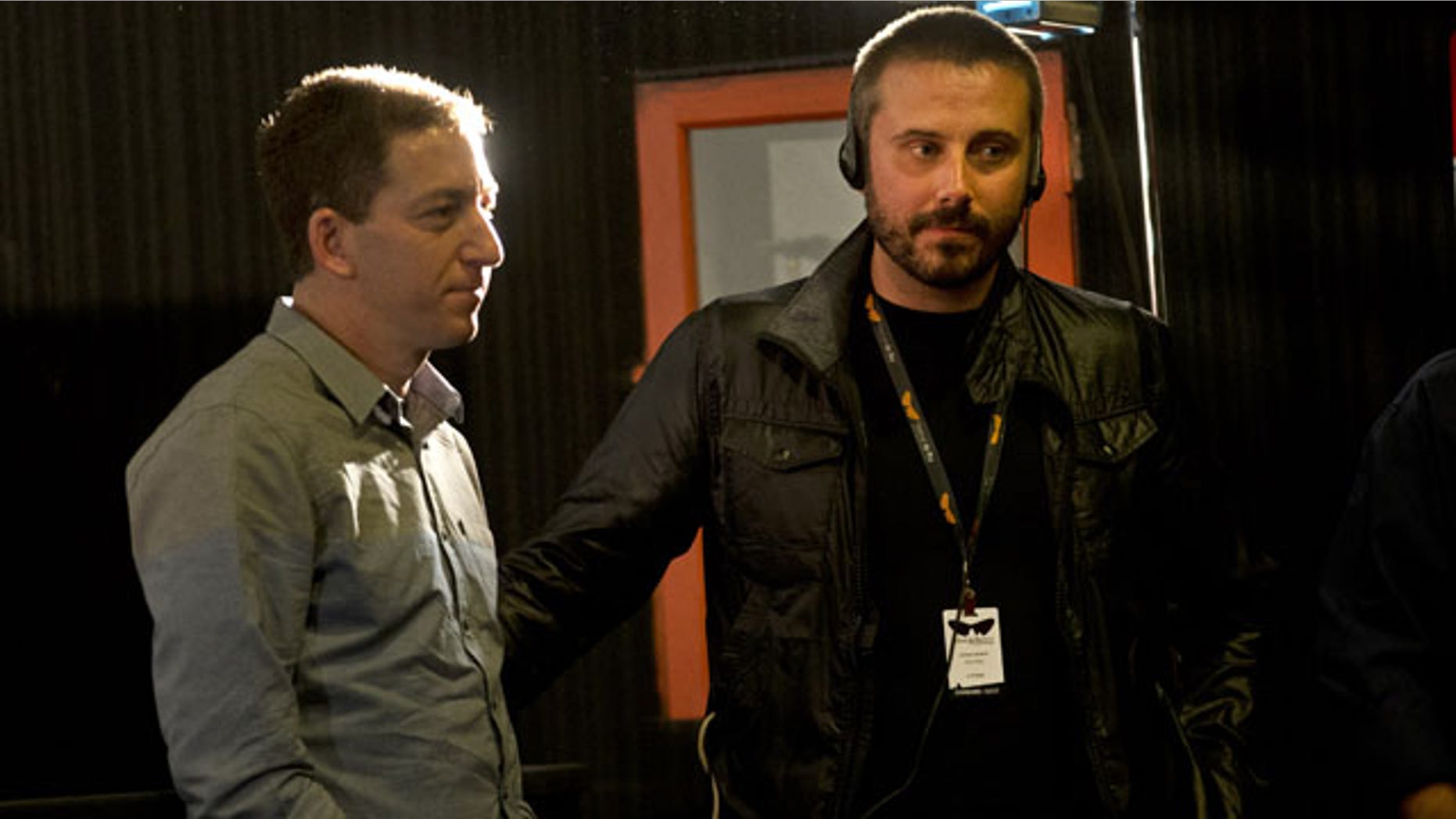 September 28, 2013: American journalist Jeremy Scahill, right, and Glenn Greenwald wait for the beginning of a panel following the screening of the "Dirty Wars" documentary, based on a book of the same name by Scahill, at the Rio Film Festival in Rio de Janeiro, Brazil. (AP Photo)