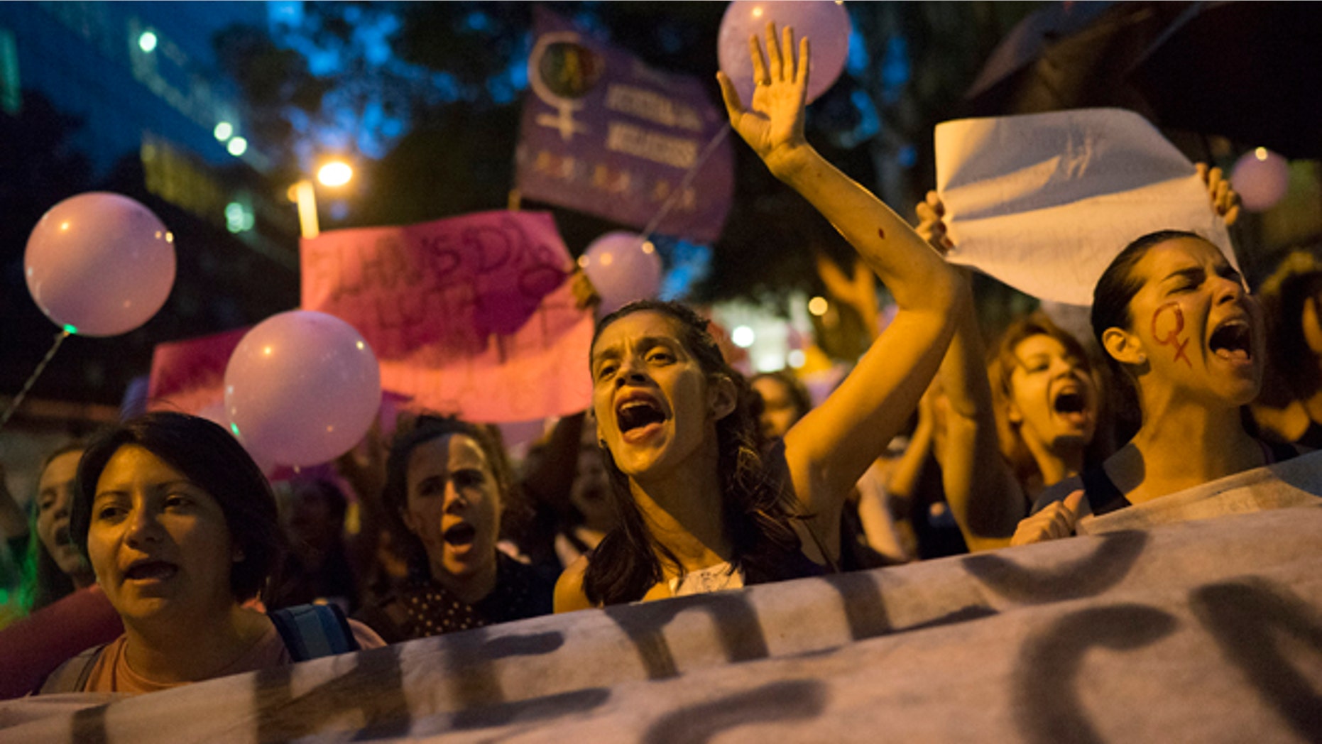 Women participate in a demonstration against gender violence in Rio de Janeiro, Brazil, Tuesday, Oct. 25, 2016. Women in Brazil organized protests condemning violence against women following the brutal gang rape of a woman on the outskirts of Rio de Janeiro by suspected drug dealers. (AP Photo/Leo Correa)