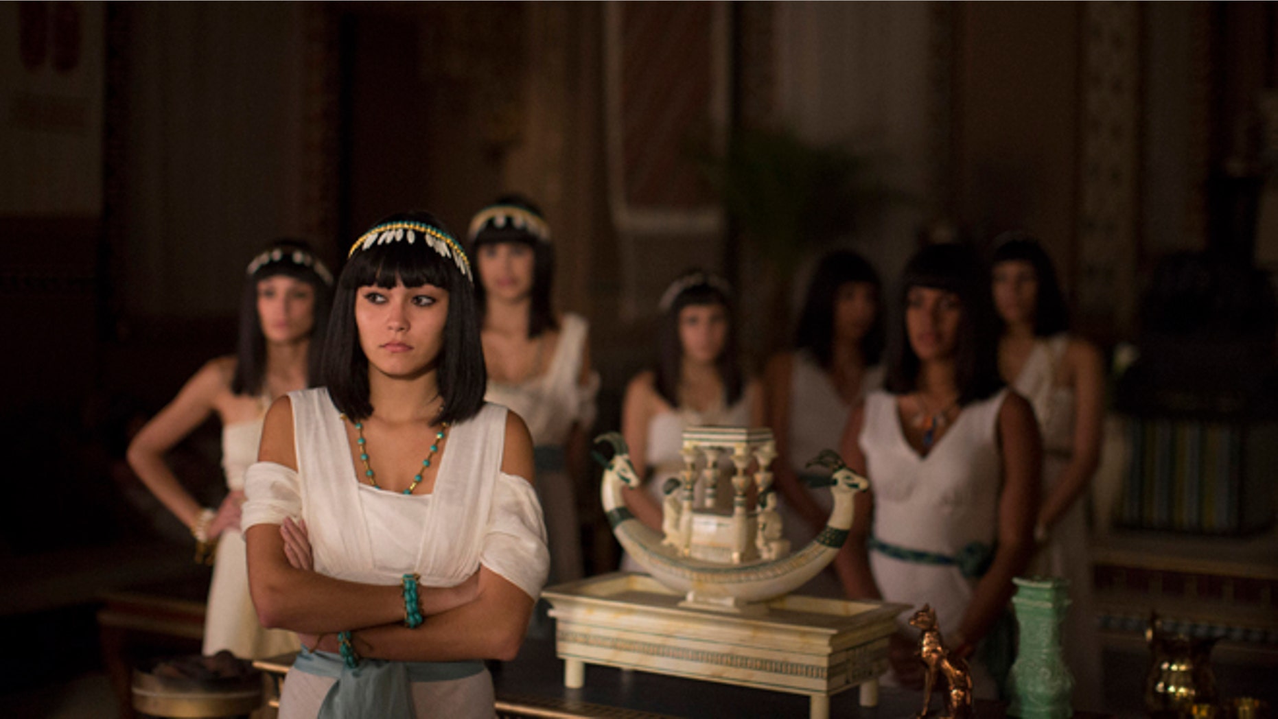 In this May 13, 2015 photo, Brazilian actresses wait backstage for their cue during the filming of the Brazilian prime-time soap opera, "The Ten Commandments" at a RecNov studio, in Rio de Janeiro, Brazil. Swathed in Egyptian cotton robes and sporting lapis lazuli jewelry and Cleopatra wigs, some of the characters are based on Biblical or other historic figures, while others are invented. (AP Photo/Leo Correa)