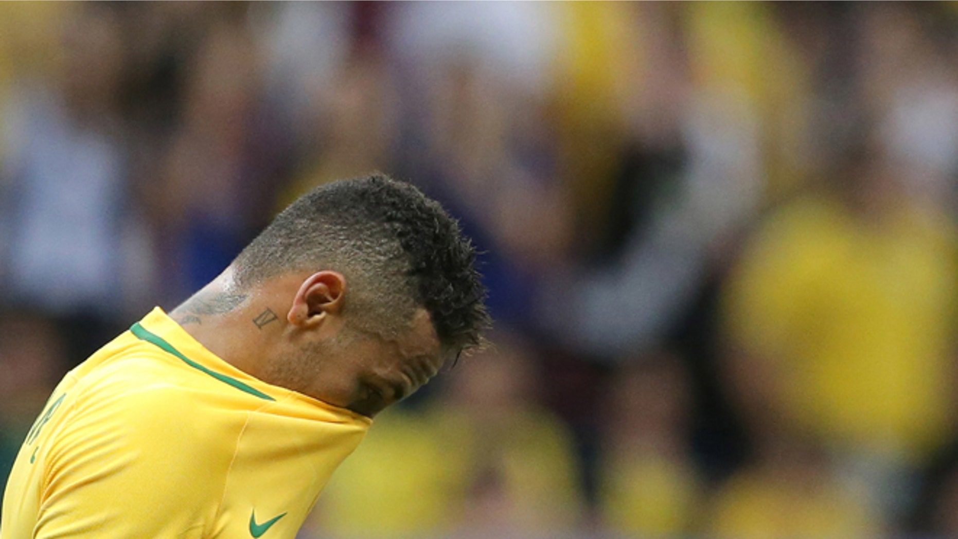 Brazil's Neymar reacts at the end of a group A match of the men's Olympic football tournament between Brazil and Iraq at the National Stadium in Brasilia, Brazil, Sunday, Aug. 7, 2016. The game ended in a 0-0 draw. (AP Photo/Eraldo Peres)