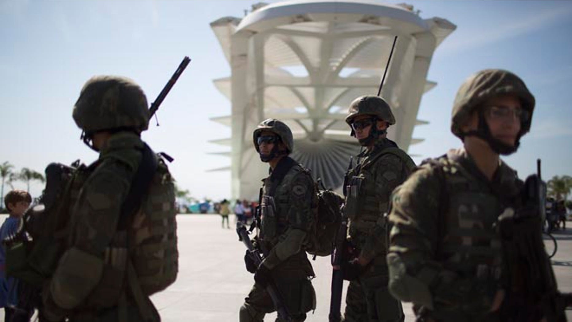 Soldiers stand guard in front of the Museum of Tomorrow in Rio de Janeiro, Brazil, Saturday, July 9, 2016.