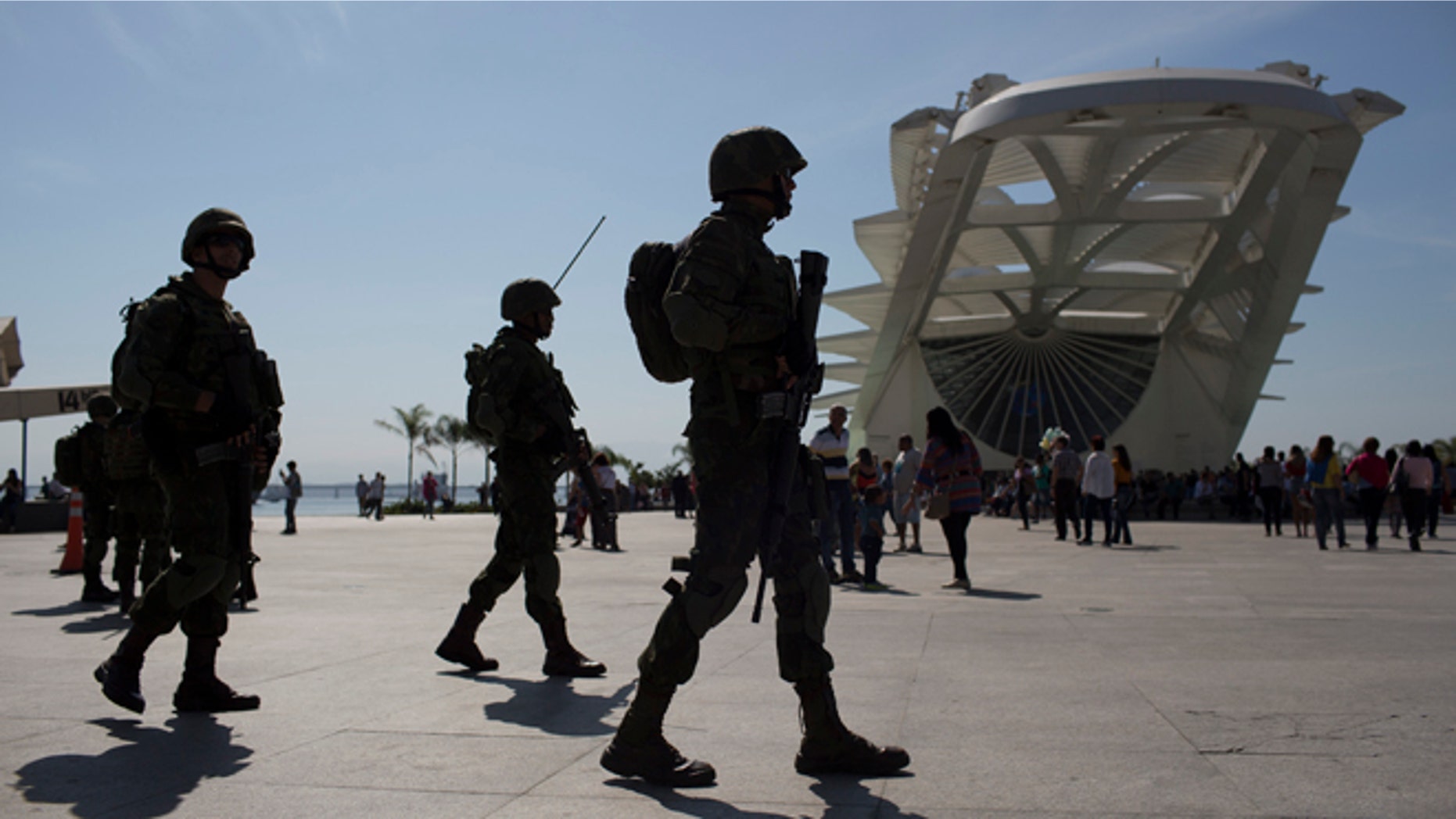 Soldiers patrol outside the Museum of Tomorrow in Rio de Janeiro, Brazil, Saturday, July 9, 2016. Roughly twice the security contingent at the London Olympics will be deployed during the August games in Rio, which are expected to draw thousands of foreigners to a city where armed muggings, stray bullets and turf wars between heavily armed drug gangs are routine. (AP Photo/Leo Correa)