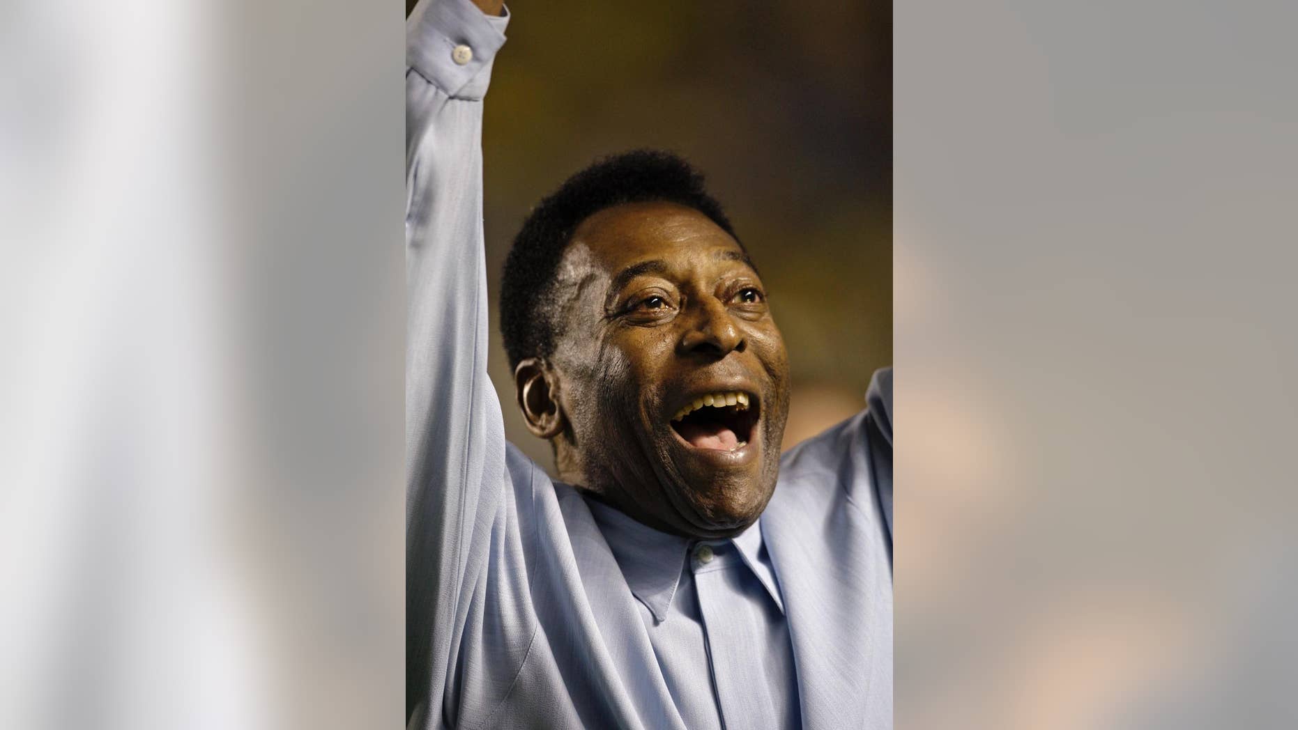 FILE - In this Nov. 19, 2008 file photo, Brazil's soccer great Pele greets supporters prior to a friendly soccer match, in Brasilia, Brazil. A Brazilian hospital says Pele has been transferred to a "special care" unit to be monitored while being treated for a urinary infection. The Albert Einstein hospital in Sao Paulo, said in a statement Thursday. Nov. 27, 2014, that the 74-year-old Pele was transferred to a quieter wing. (AP Photo/Silvia Izquierdo, File)