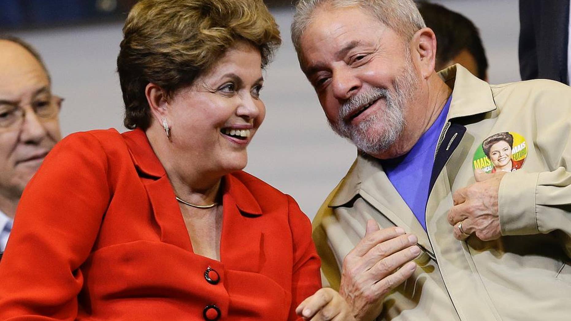 FILE - In this Aug. 7, 2014,file photo, Brazil's President Dilma Rousseff and former Brazilian President Luiz Ignacio Lula da Silva attend an election campaign rally in Sao Paulo, Brazil. A convicted black market money dealer who turned state’s evidence told lawmakers on Tuesday, Aug. 25, 2015, that President Rousseff and her predecessor, former President Lula da Silva, knew of the sprawling corruption kickback scheme that has engulfed state-run oil company Petrobras. (AP Photo/Andre Penner,File)