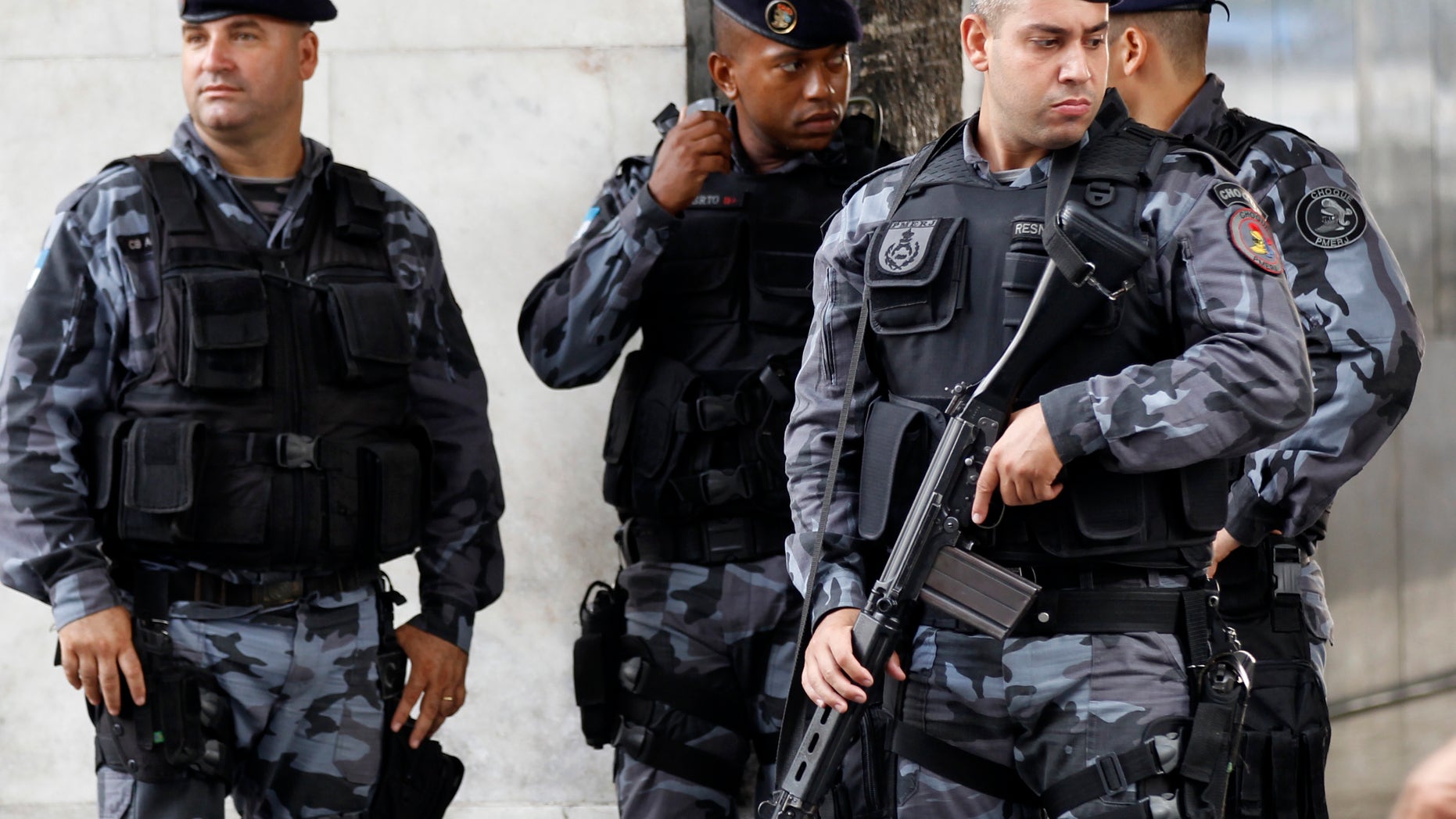 Feb. 10, 2012: Police officers stand at their headquarters in Rio de Janeiro, Brazil.