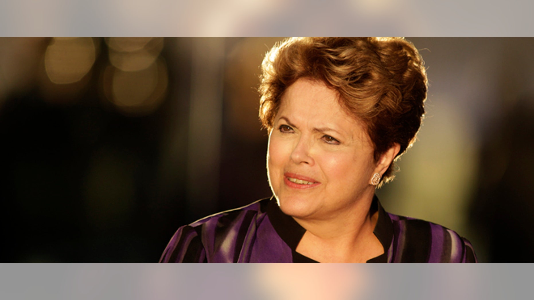 Brazil's President Dilma Rousseff arrives to meet members of Brazil's soccer team at Alvorada palace in Brasilia, Brazil, Monday, Sept. 2, 2013. The Brazilian government condemned a U.S. spy program that reportedly targeted the nation's leader, labeled it an "unacceptable invasion" of sovereignty and called Monday for international regulations to protect citizens and governments alike from cyber espionage. (AP Photo/Eraldo Peres)