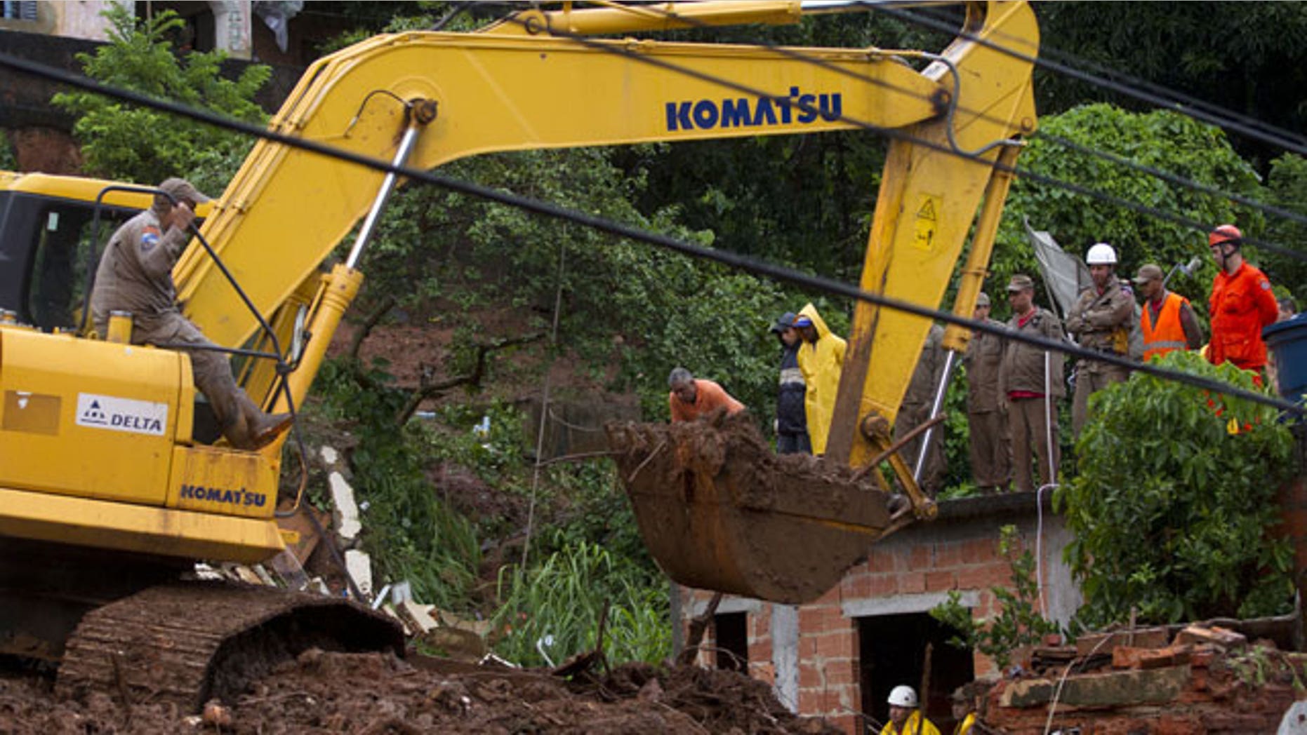 January 9, 2012: Rescue personnel work at the site of a mudslide that killed at least eight people in Jamapara, Rio de Janeiro state, Brazil.