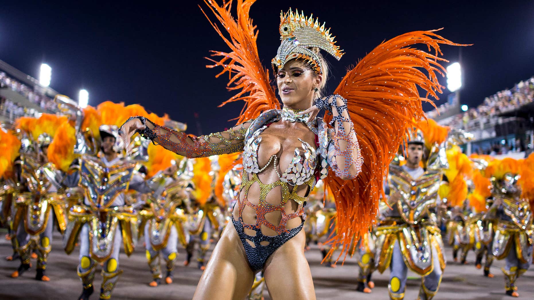 RIO DE JANEIRO, BRAZIL - MARCH 03: Members of Unidos da Tijuca Samba School during their parade at 2014 Brazilian Carnival at Sapucai Sambadrome on March 03, 2014 in Rio de Janeiro, Brazil. Rio's two nights of Carnival parades began on March 2 in a burst of fireworks and to the cheers of thousands of tourists and locals who have previously enjoyed street celebrations (known as "blocos de rua") all around the city. (Photo by Buda Mendes/Getty Images)