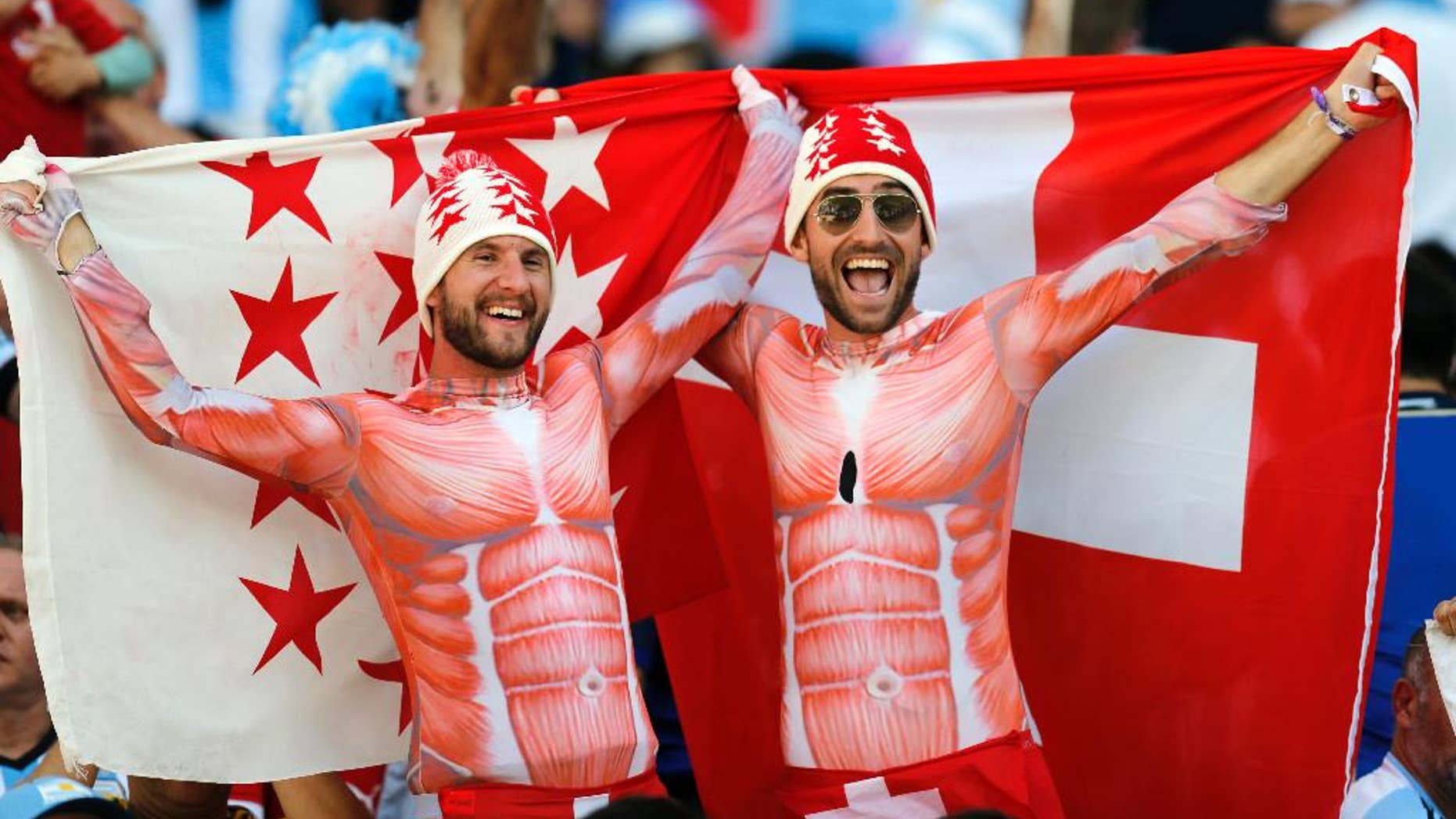 Swiss supporters cheer before the start of the World Cup round of 16 soccer match between Argentina and Switzerland at the Itaquerao Stadium in Sao Paulo, Brazil, Tuesday, July 1, 2014. (AP Photo/Frank Augstein)