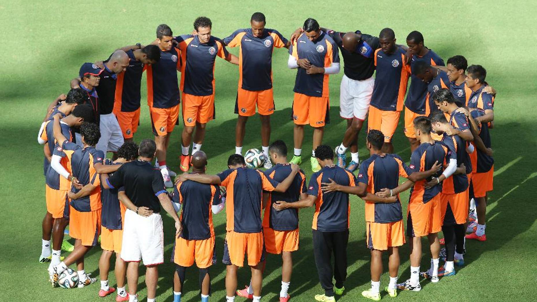 Costa Rica's players start a training session the day before their World Cup soccer match with Italy at the Arena Pernambuco stadium in Recife, Brazil, Thursday, June 19, 2014. (AP Photo/Antonio Calanni)