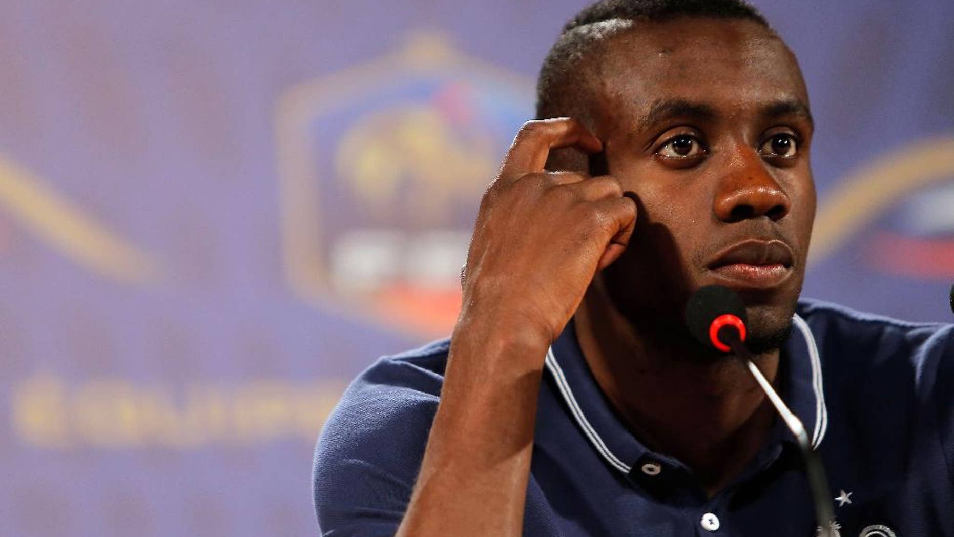 France's player Blaise Matuidi gestures as he answers questions during a press conference in Ribeirao Preto, Brazil, Friday, June 13, 2014. France is in group E at the World Cup soccer tournament and plays its first match Sunday. (AP Photo/David Vincent)