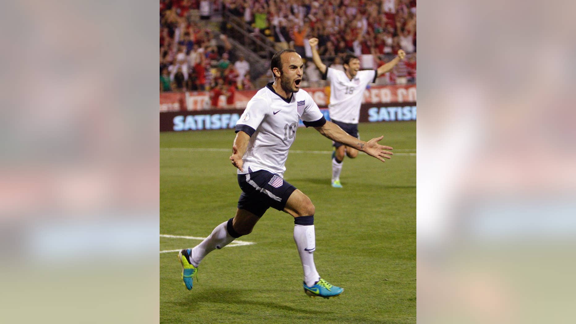 FILE - In this Sept. 10, 2013, file photo, United States' Landon Donovan celebrates after scoring a goal against Mexico during the second half of a World Cup qualifying soccer match in Columbus, Ohio. Donovan hasn't just resurrected his career with the U.S. team, he may be the Americans' most important player. (AP Photo/Jay LaPrete, File) - YOU CAN FIND THE ENTIRE WORLD CUP COLLECTION ON APIMAGES.COM