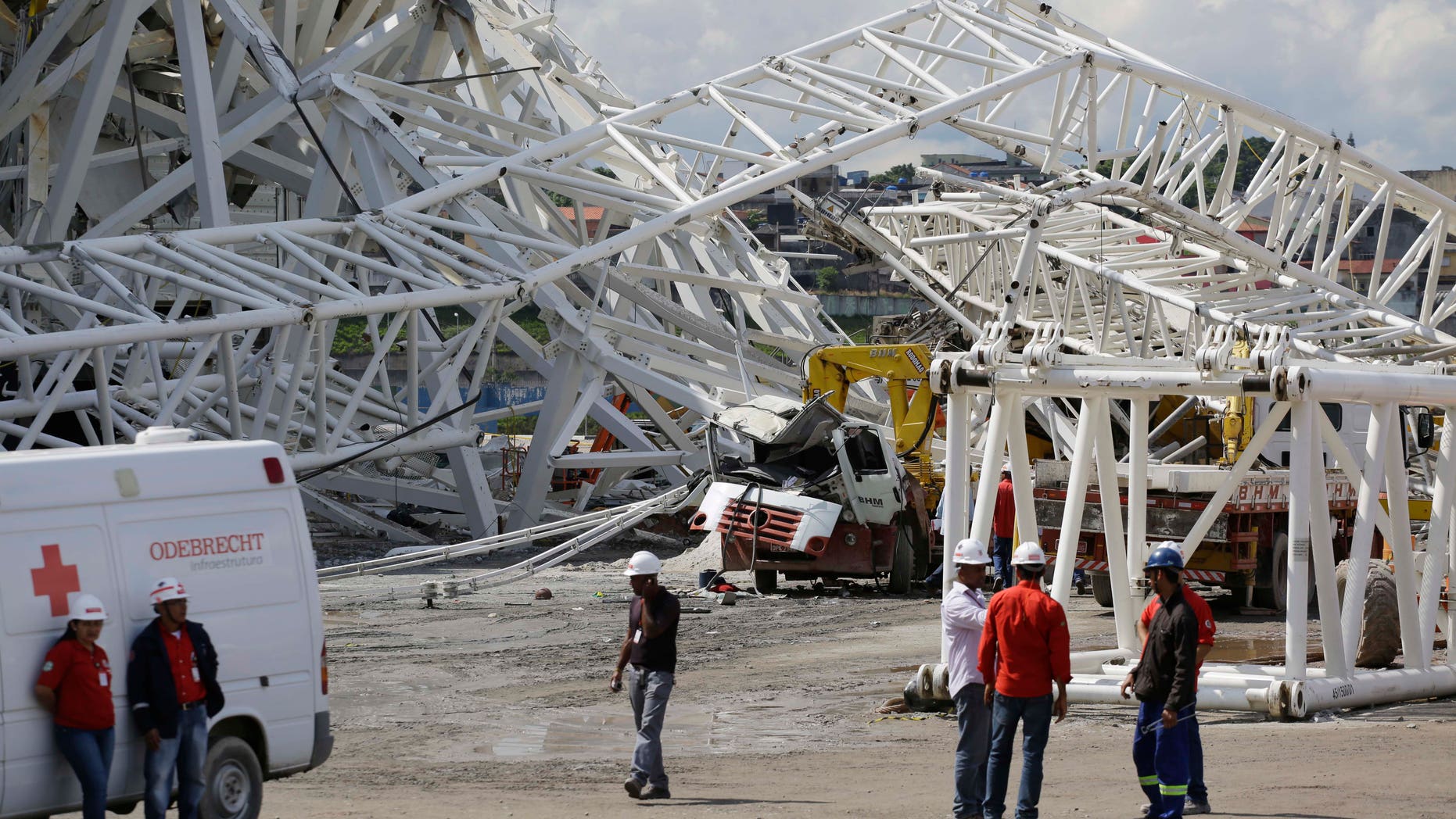 Nov. 27, 2013: People stand near a metal structure that buckled on part of the Itaquerao Stadium in Sao Paulo, Brazil.