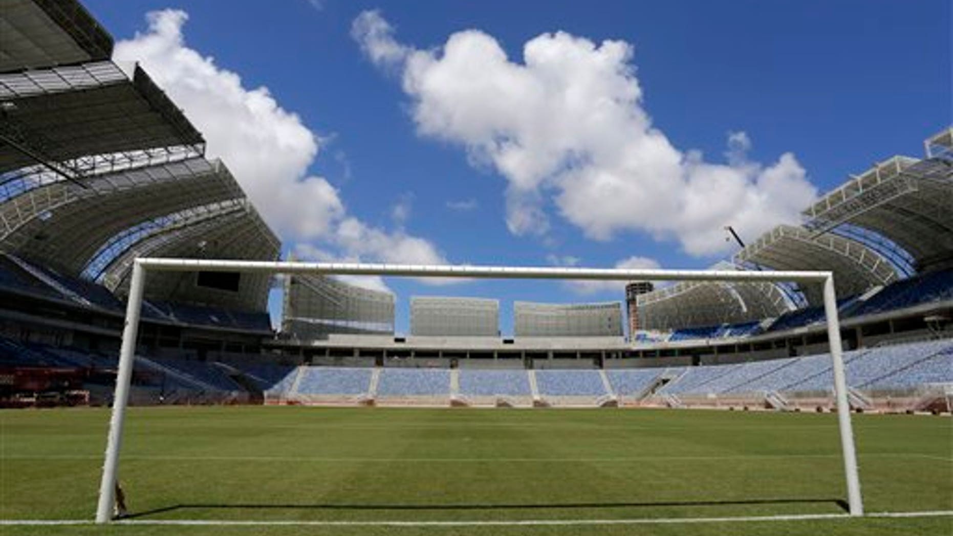 The empty goal stands in the Estadio das Dunas in Natal, Brazil, Friday, Dec. 13, 2013. Four matches of the 2014 soccer World Cup will be played in the stadium. (AP Photo/Ferdinand Ostrop)