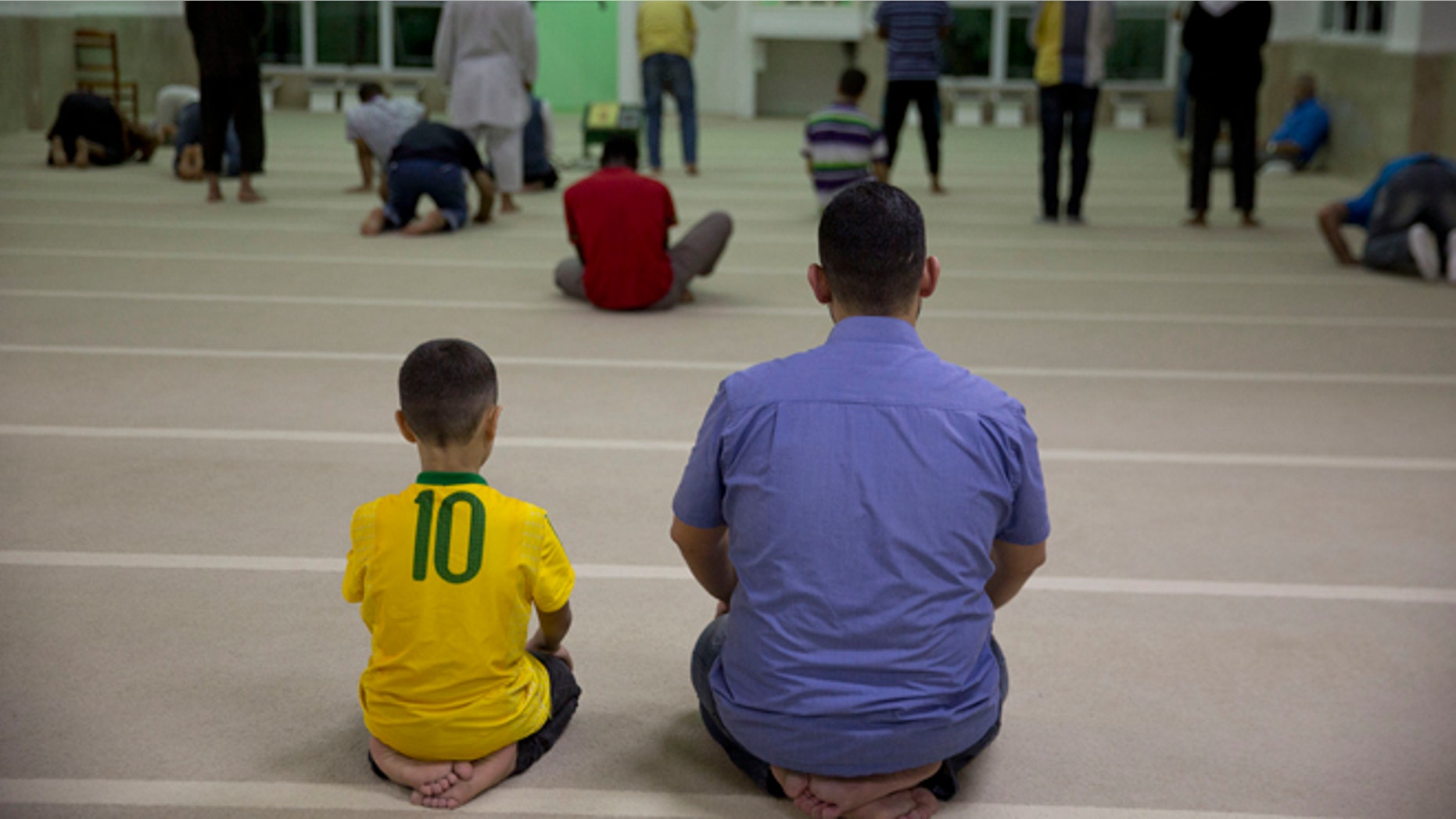 Syrian refugees attends prayer at a mosque in Sao Paulo, Brazil, Monday, May 25, 2015. Nearly 2,000 Syrians are trying to make a new life in Brazil, which has accepted more Syrians fleeing the violence at home than any other nation in the Americas with the exception of Canada. (AP Photo/Andre Penner)