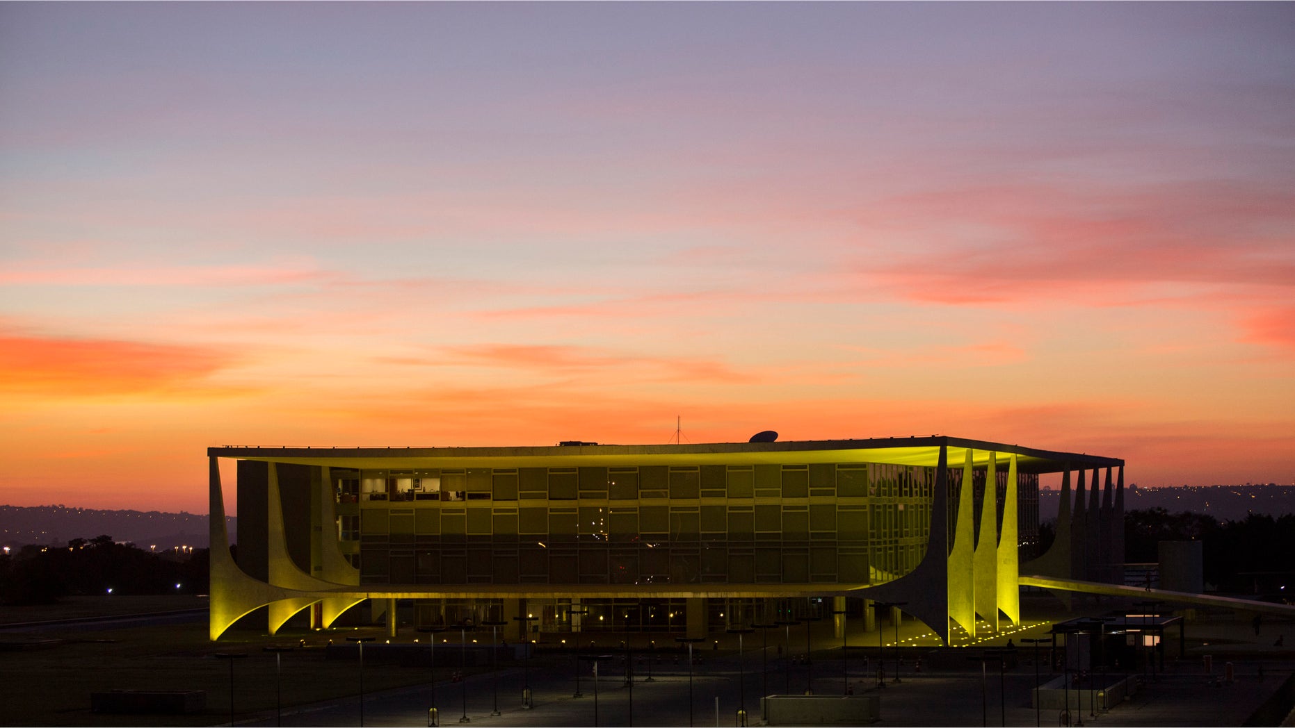 FILE - In this May 12, 2016, file photo, Planalto presidential palace during sunrise in Brasilia, Brazil, after the Senate voted to suspend President Dilma Rousseff pending an impeachment trial. For the sake of the nationâs 200 million people, and for all the South American nations whose fortunes are tied to Brazilâs powerhouse economy, one hopes that her vice president, now acting President, Michel Temer know what to do. (AP Photo/Felipe Dana)