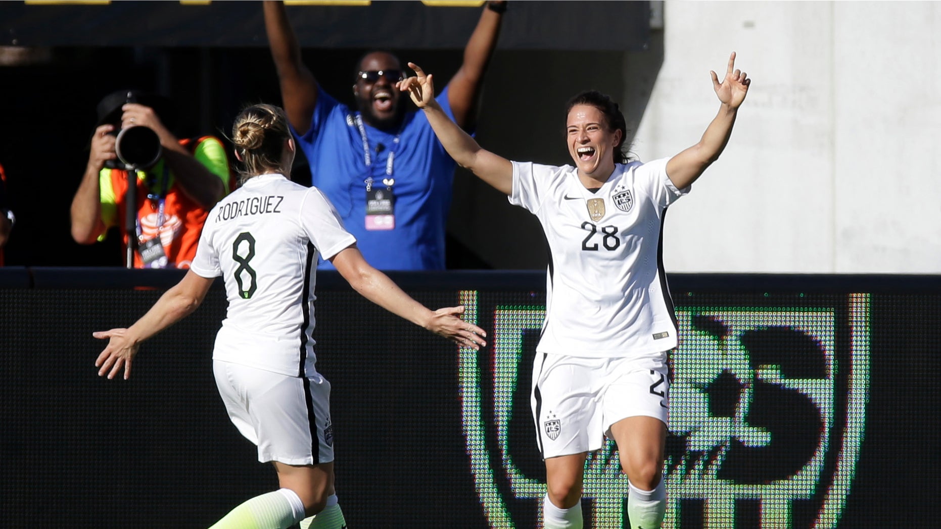 United States' Stephanie McCaffrey (28) celebrates her goal against Brazil with teammate Amy Rodriguez (8) during the second half of an international friendly soccer match Sunday, Oct. 25, 2015, in Orlando, Fla. The United States won 3-1. (AP Photo/John Raoux)