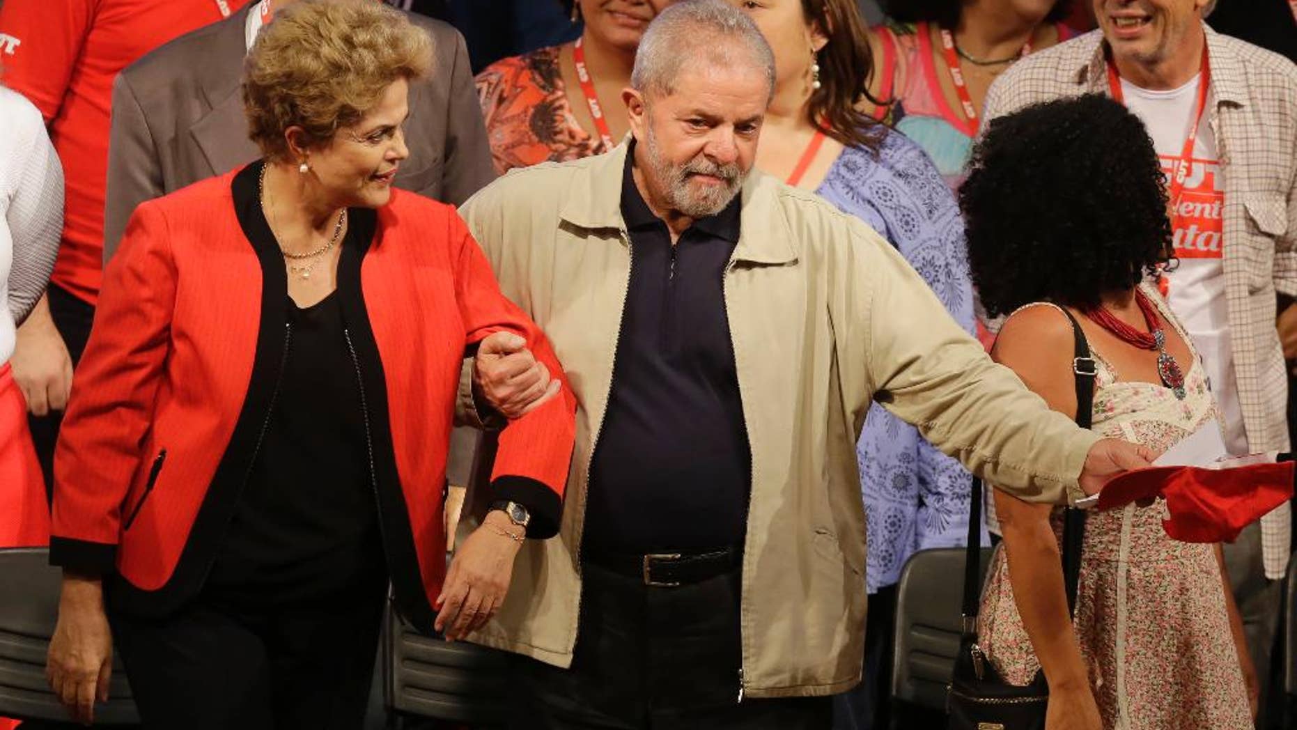 Brazil's former President Luiz Inacio Lula da Silva, right, and current President Dilma Rousseff attend the Central Workers Union annual convention in Sao Paulo, Brazil, Tuesday, Oct. 13, 2015. (AP Photo/Nelson Antoine)