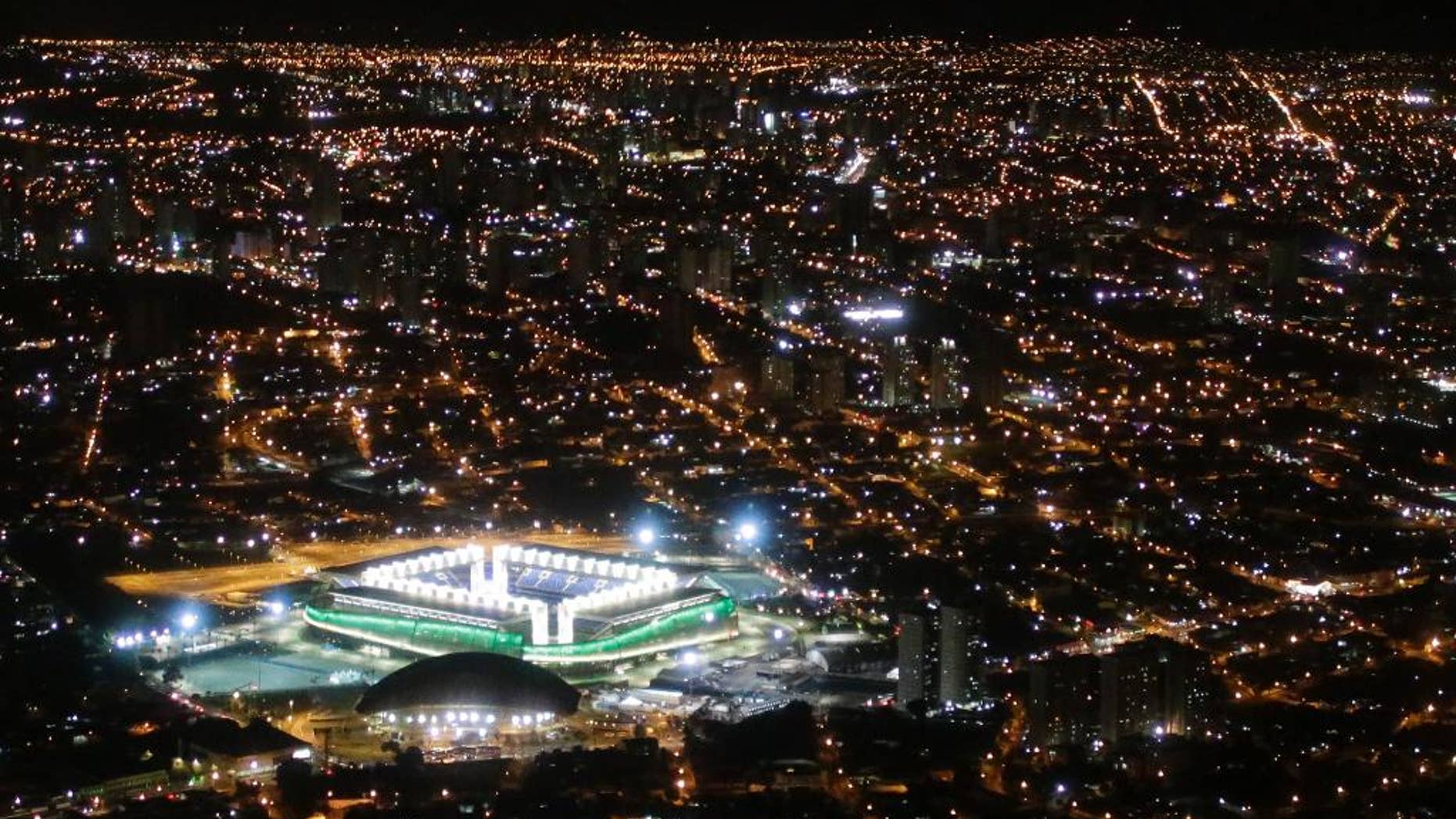 FILE - In this June 24, 2014 file photo, a night aerial view of the Arena Pantanal stadium in Cuiaba, Brazil. The new stadium in the western Brazilian city is being closed for "emergency repairs" just seven months after it held four World Cup matches. (AP Photo/Felipe Dana, File)