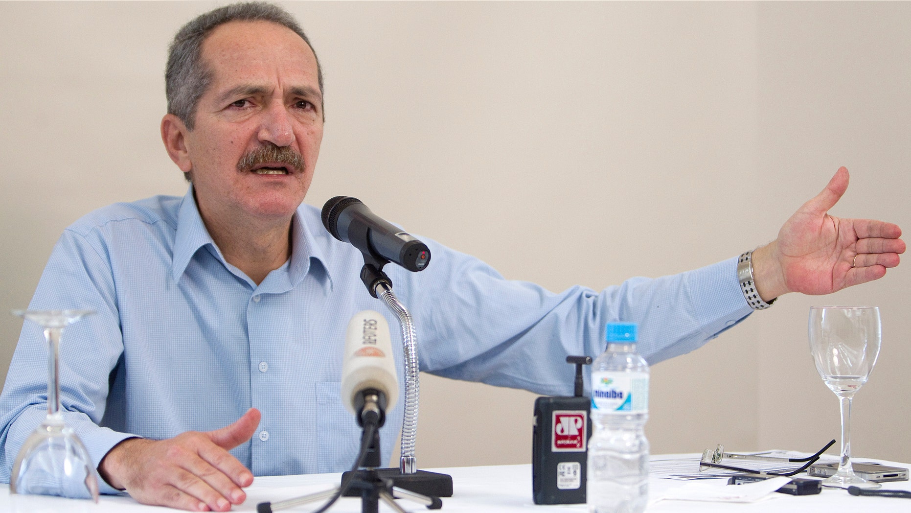 Brazil's Sports Minister Aldo Rebelo speaks about the criticism over 2014 World Cup preparations during a news conference in Sao Paulo, Brazil, Saturday March 3, 2012. (AP Photo/Andre Penner)