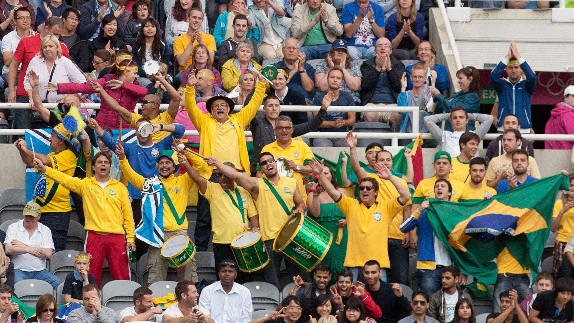 Brazil fans celebrate during a quarterfinal men's soccer match against Honduras at the London 2012 Summer Olympics, Saturday, Aug. 4, 2012, at St James Park in Newcastle, England. (AP Photo/Chris Clark)