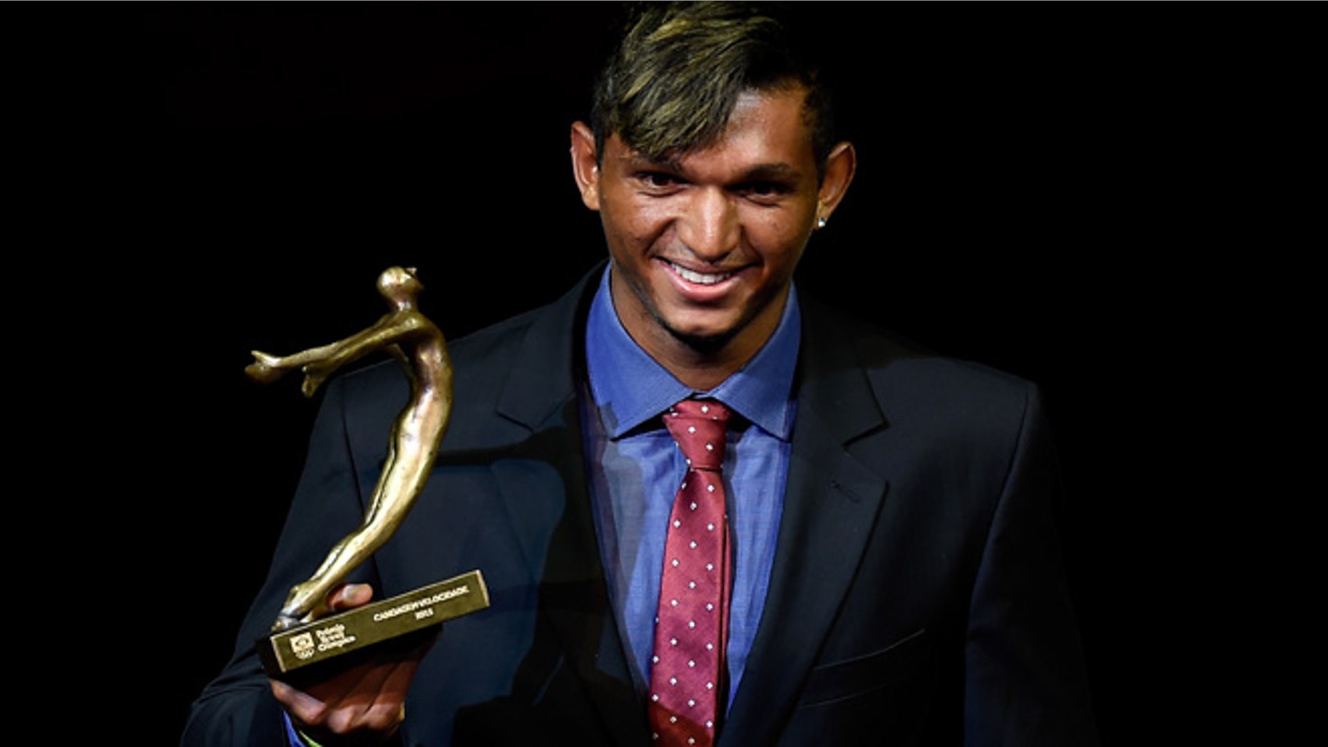 RIO DE JANEIRO, BRAZIL - DECEMBER 15: Brazilian Canoe Sprint competitor Isaquias Queiroz is awarded during the ceremony of Brazil's Olympics award Premio Brasil Olimpico at Bradesco Theater on December 15, 2015 in Rio de Janeiro, Brazil. (Photo by Buda Mendes/Getty Images)