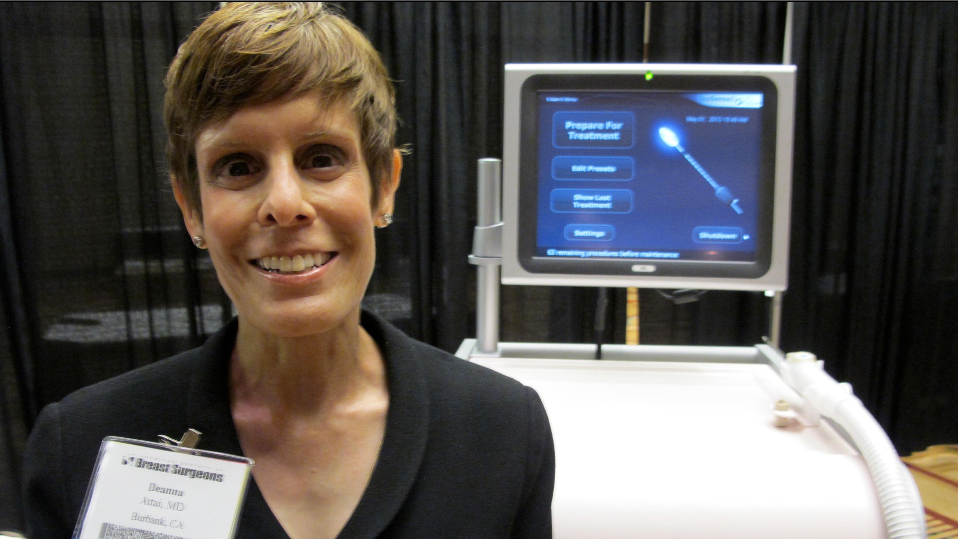 Dr. Deanna Attai, who is on the board of directors for American Society of Breast Surgeons, stands in front of cryoablation machine at the American Society of Breast Surgeons conference on May 1, 2013 in Chicago.