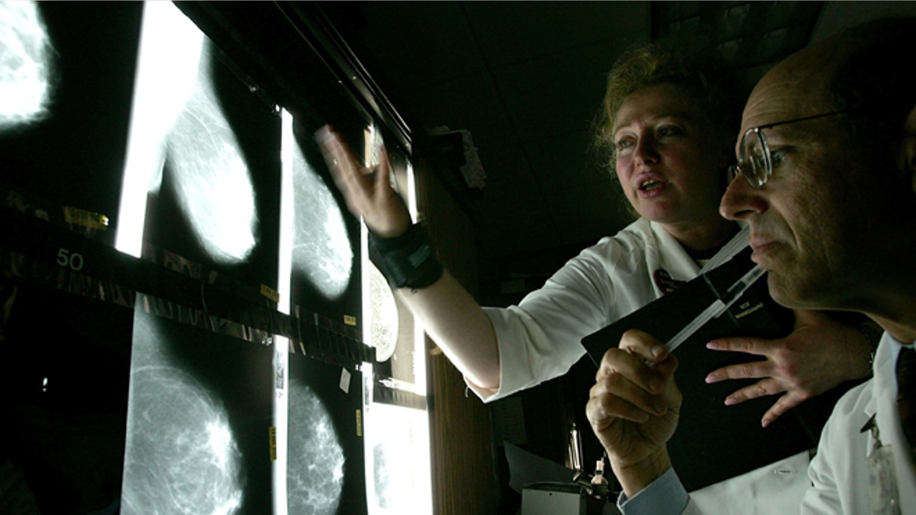 SAN FRANCISCO - AUGUST 18: Dr. Edward Sickles MD (R) and Larisa Gurilnik RT look at films of breast x-rays at the UCSF Comprehensive Cancer Center August 18, 2005 in San Francisco, California. The UCSF Comprehensive Cancer Center continues to use the latest research and technology to battle cancer and was recently rated 16th best cancer center in the nation by US News and World Report. (Photo by Justin Sullivan/Getty Images)
