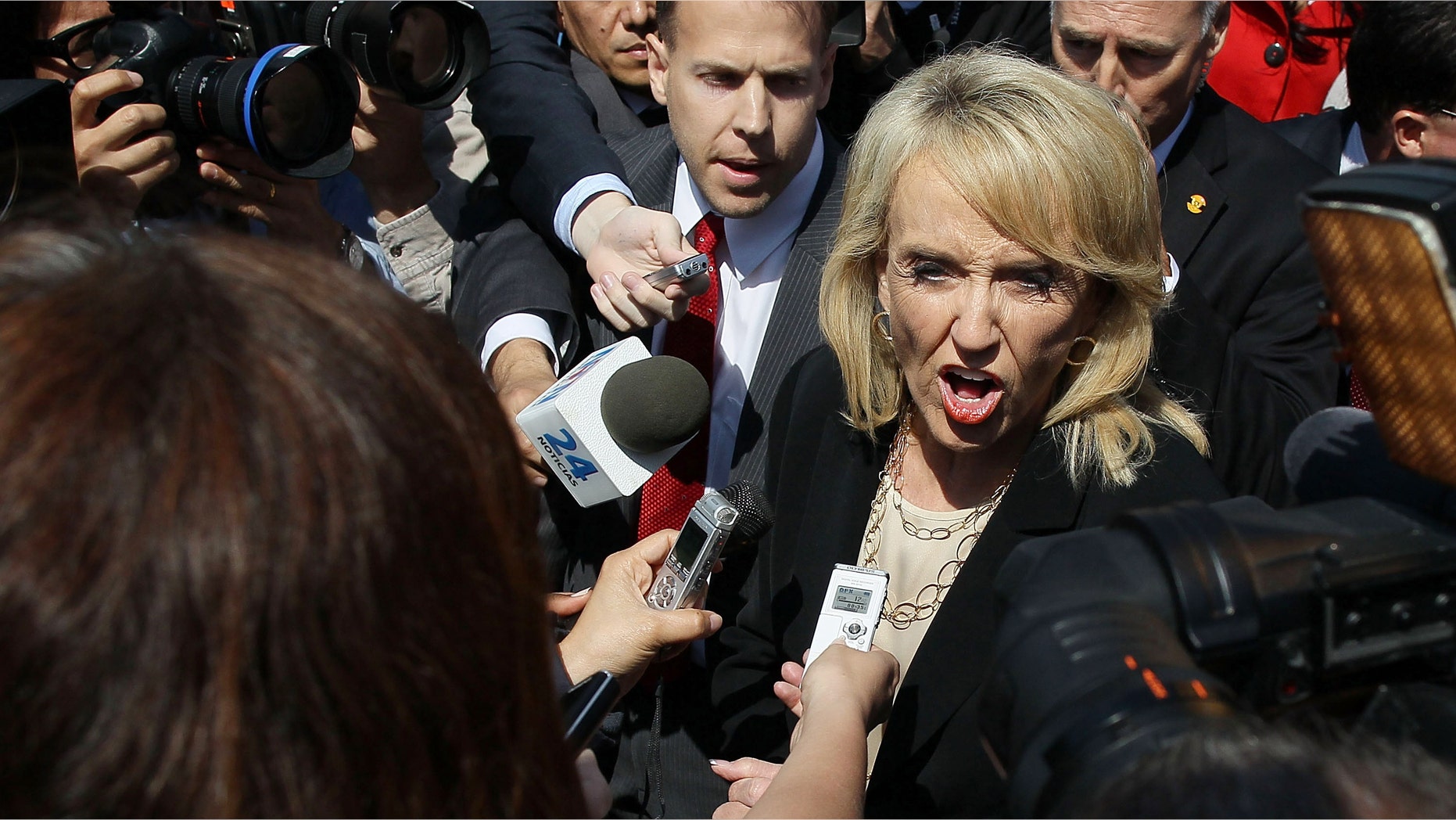 WASHINGTON, DC - APRIL 25: Arizona Gov. Jan Brewer speaks to the media after arguments at the U.S. Supreme Court, on April 25, 2012 in Washington, DC. This morning the high court will heard arguments on Arizona v. United States and will be tasked with deciding the conflicting roles of national and state governments in controlling the lives of noncitizens living illegally in the U.S.while deciding the constitutionality of Arizona's immigration law SB 1070. (Photo by Mark Wilson/Getty Images)