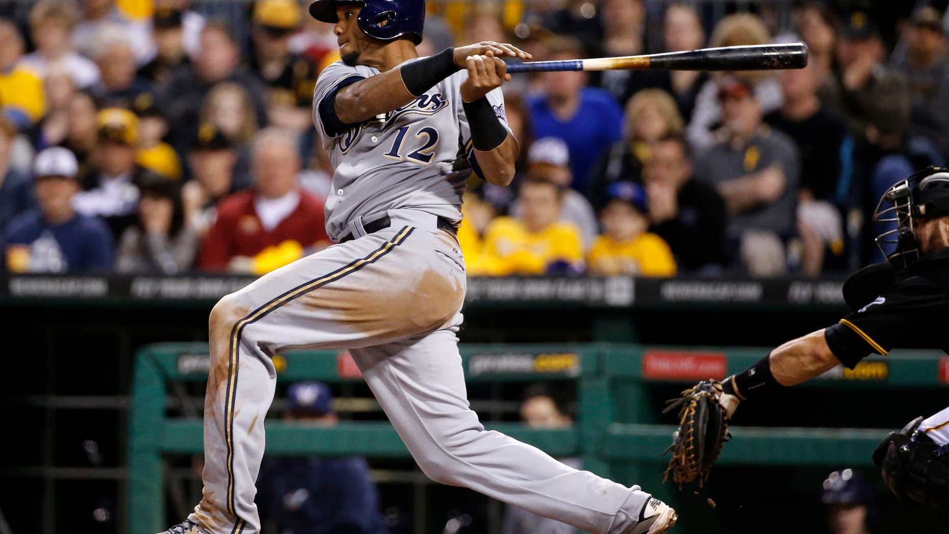 April 18, 2014: Milwaukee Brewers' Martin Maldonado drives in Scooter Gennett with a single off Pittsburgh Pirates starting pitcher Charlie Morton during the fourth inning of a baseball game in Pittsburgh.